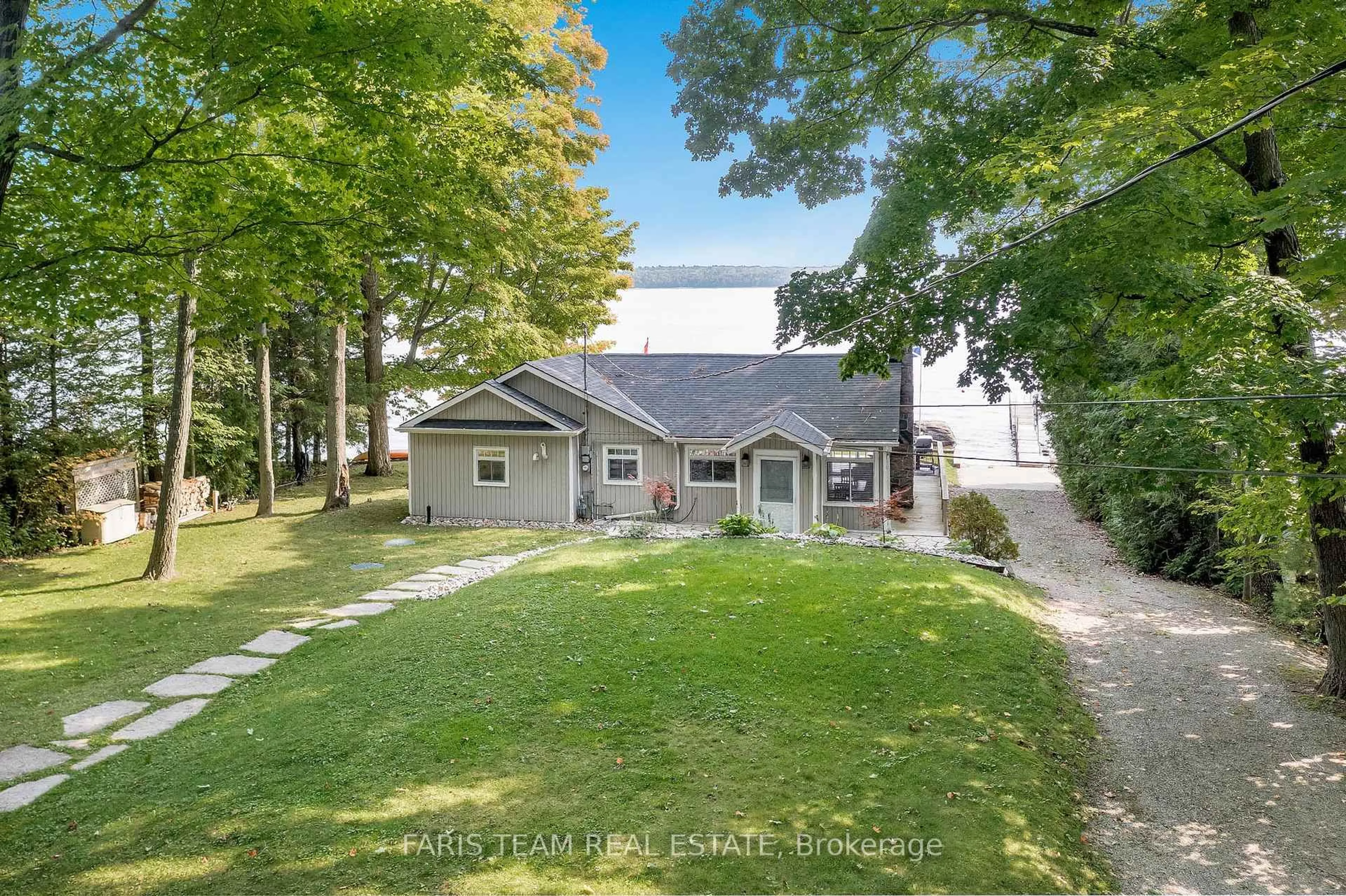 A pic from outside/outdoor area/front of a property/back of a property/a pic from drone, unknown for 1449 Champlain Rd, Tiny Ontario L9M 0C1
