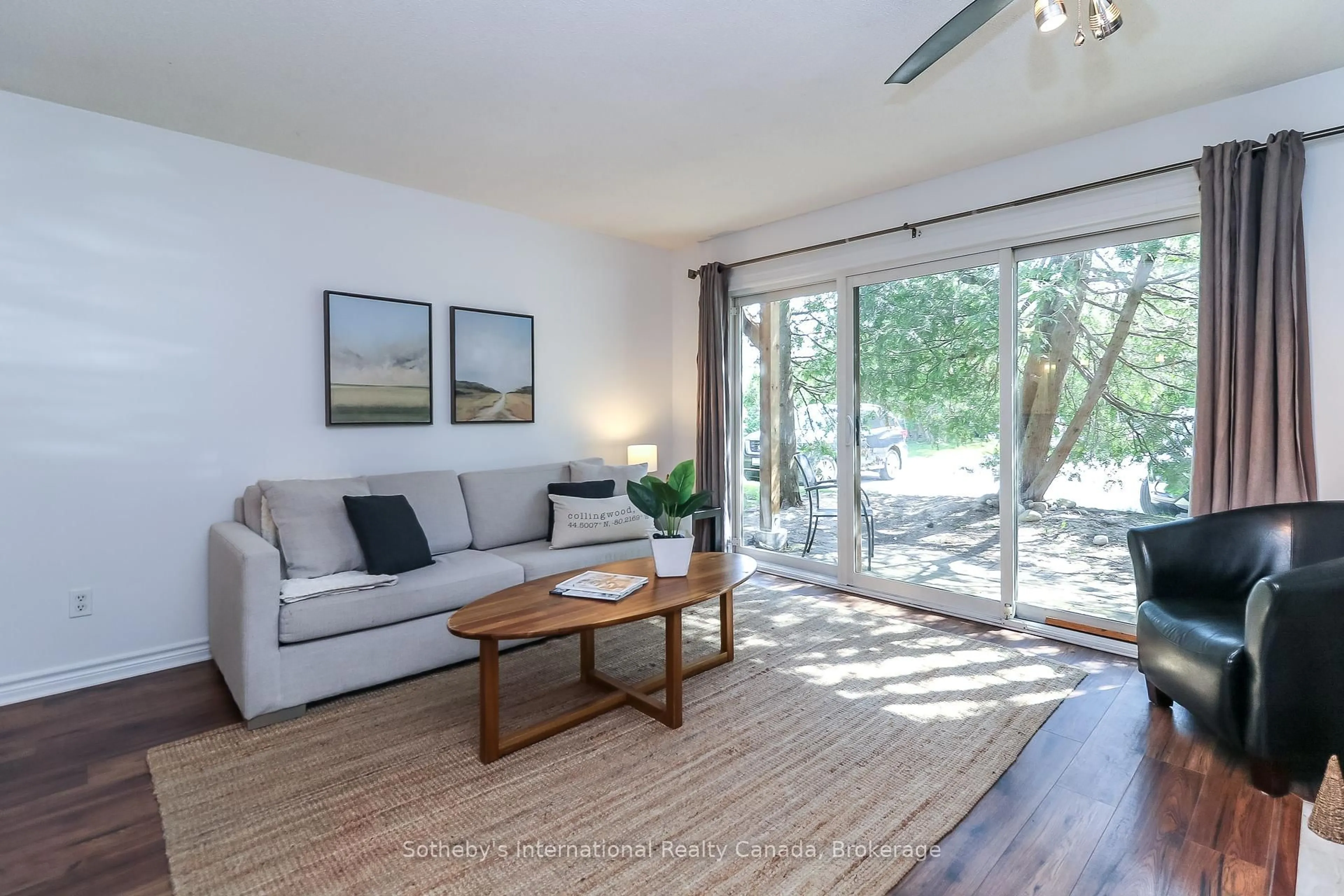 Living room with furniture, wood/laminate floor for 27 Dawson Dr #136, Collingwood Ontario L9Y 5B4