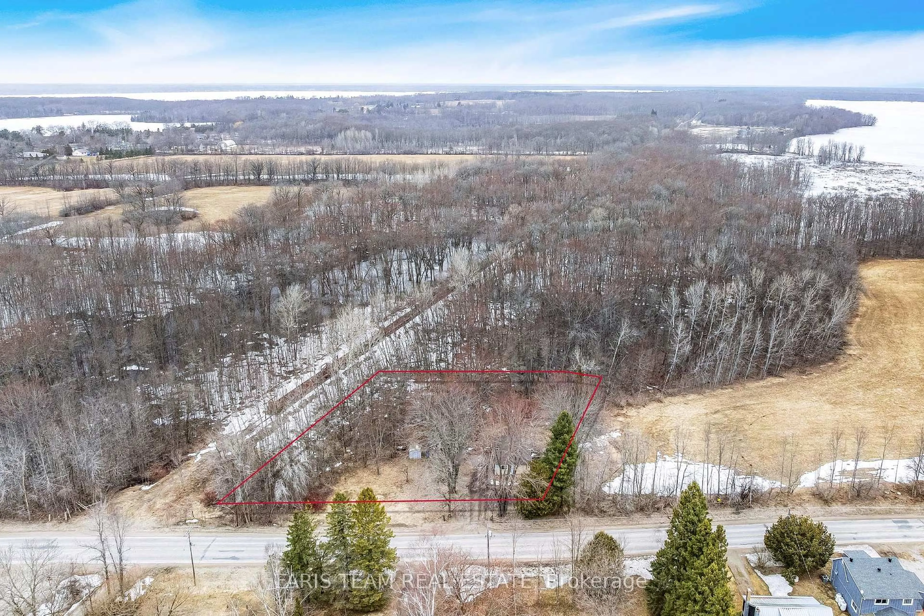 A pic from outside/outdoor area/front of a property/back of a property/a pic from drone, forest/trees view for 4076 Airport Rd, Ramara Ontario L3V 0K6