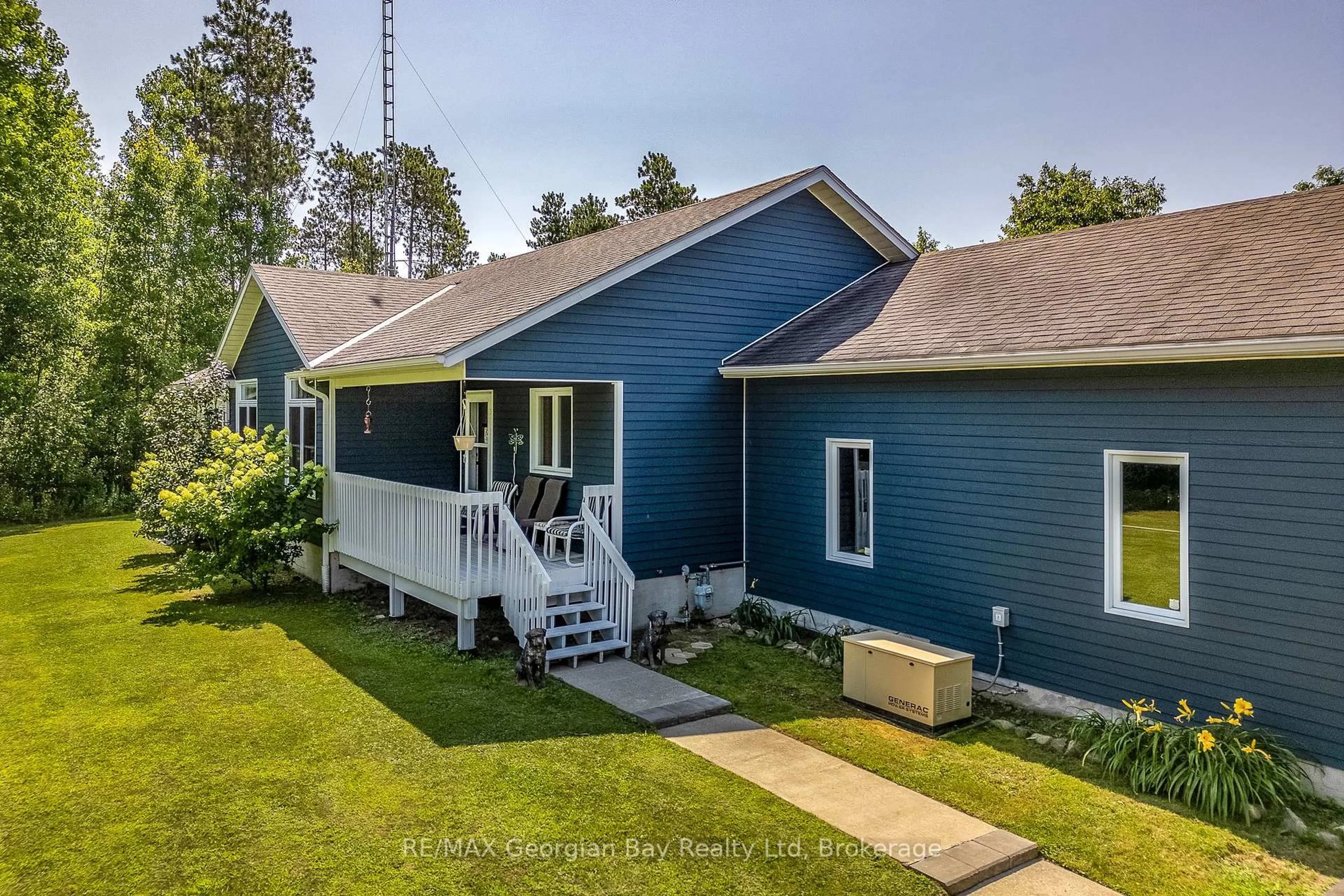 A pic from outside/outdoor area/front of a property/back of a property/a pic from drone, street for 63 Concession 9 East Concession, Tiny Ontario L0L 2J0