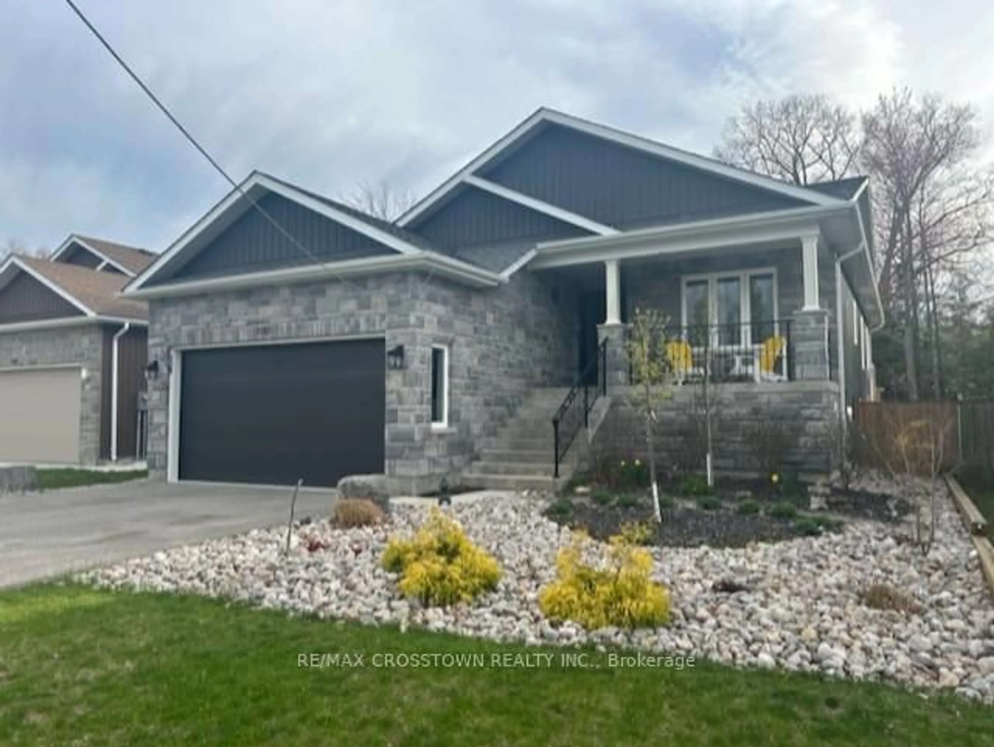Home with brick exterior material, street for 100 61st St, Wasaga Beach Ontario L9Z 1W1