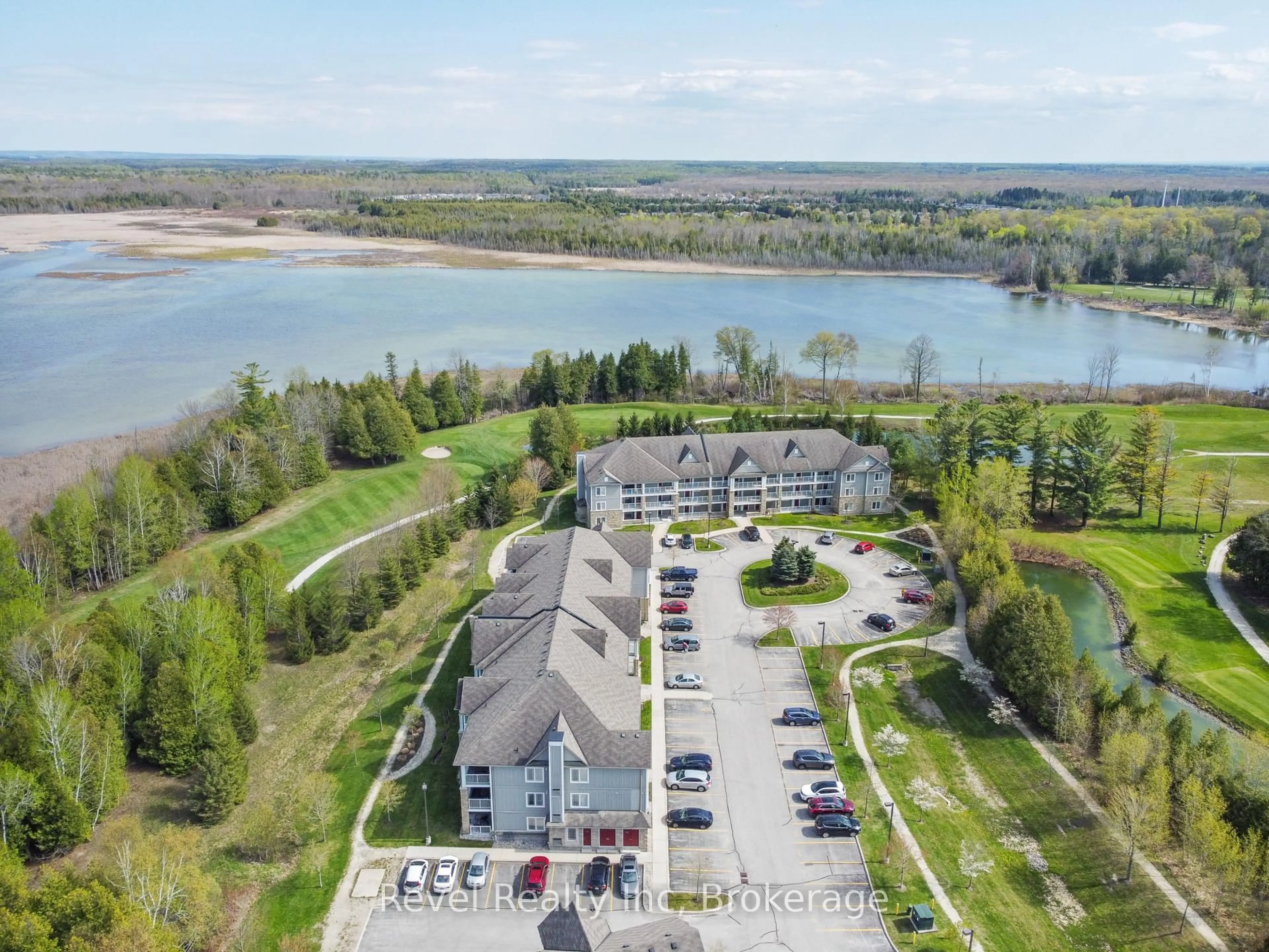 A pic from outside/outdoor area/front of a property/back of a property/a pic from drone, water/lake/river/ocean view for 50 MULLIGAN Lane #213, Wasaga Beach Ontario L9Z 0C5
