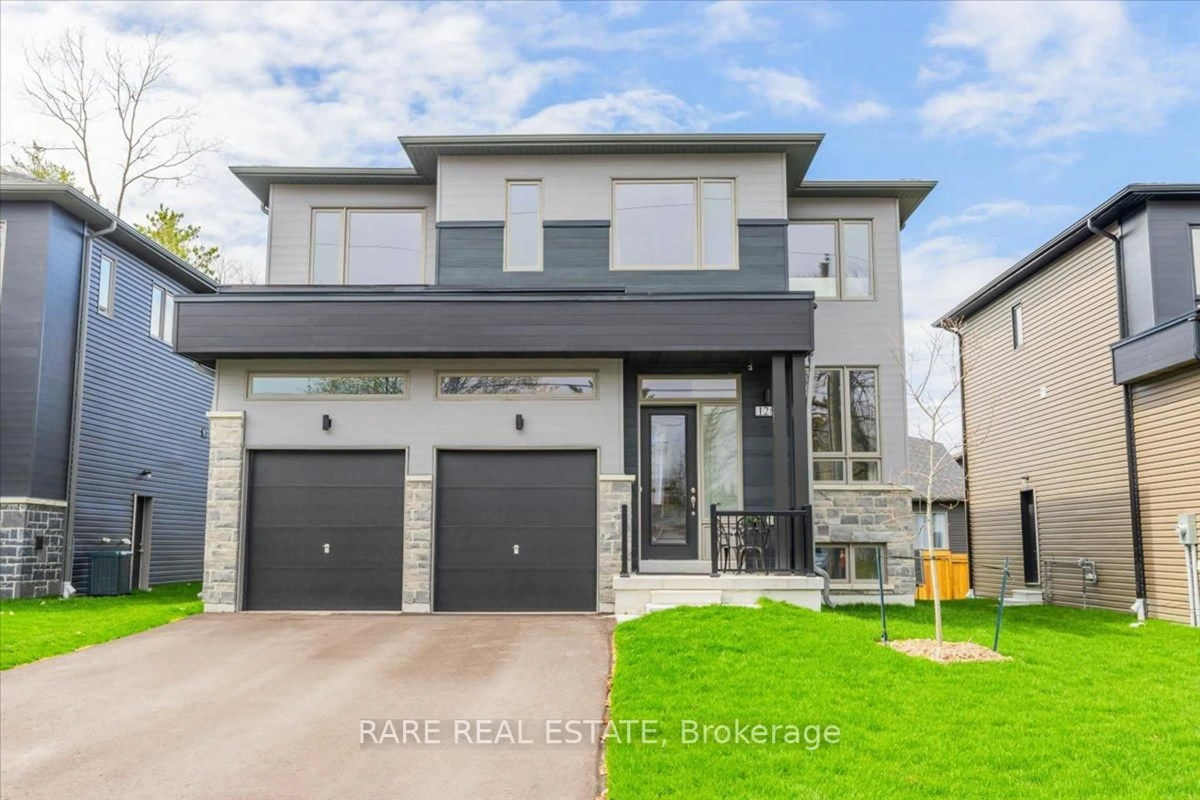 Home with brick exterior material, street for 128 Ansley Rd, Wasaga Beach Ontario L9Z 2N5