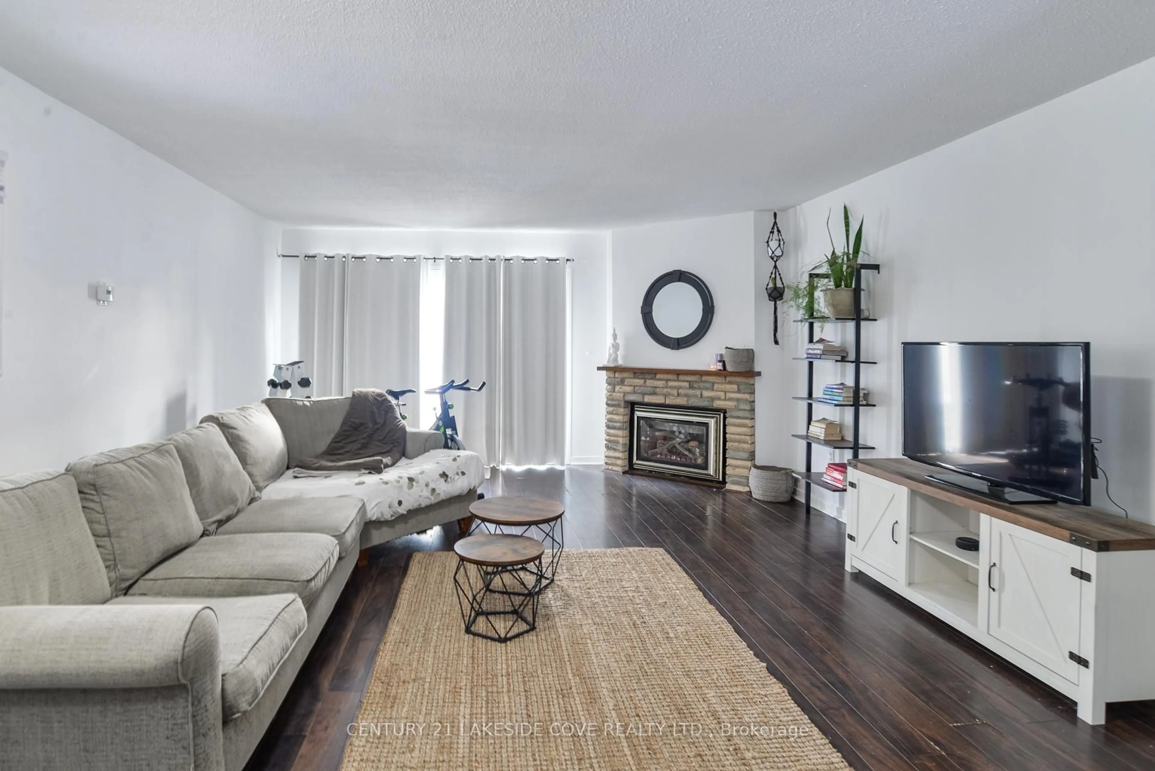 Living room with furniture, wood/laminate floor for 4 Paradise Blvd #Unit 5, Ramara Ontario L0K 1B0
