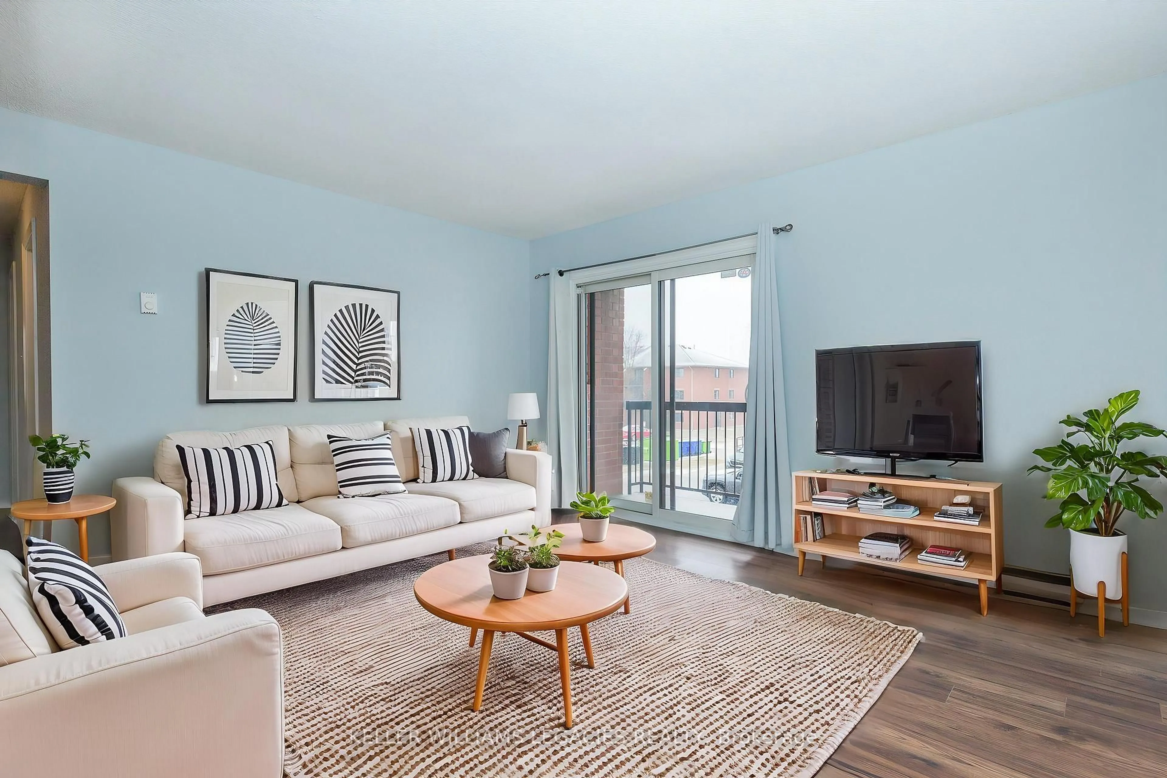 Living room with furniture, wood/laminate floor for 163 Edgehill Dr #D6, Barrie Ontario L4N 1L9