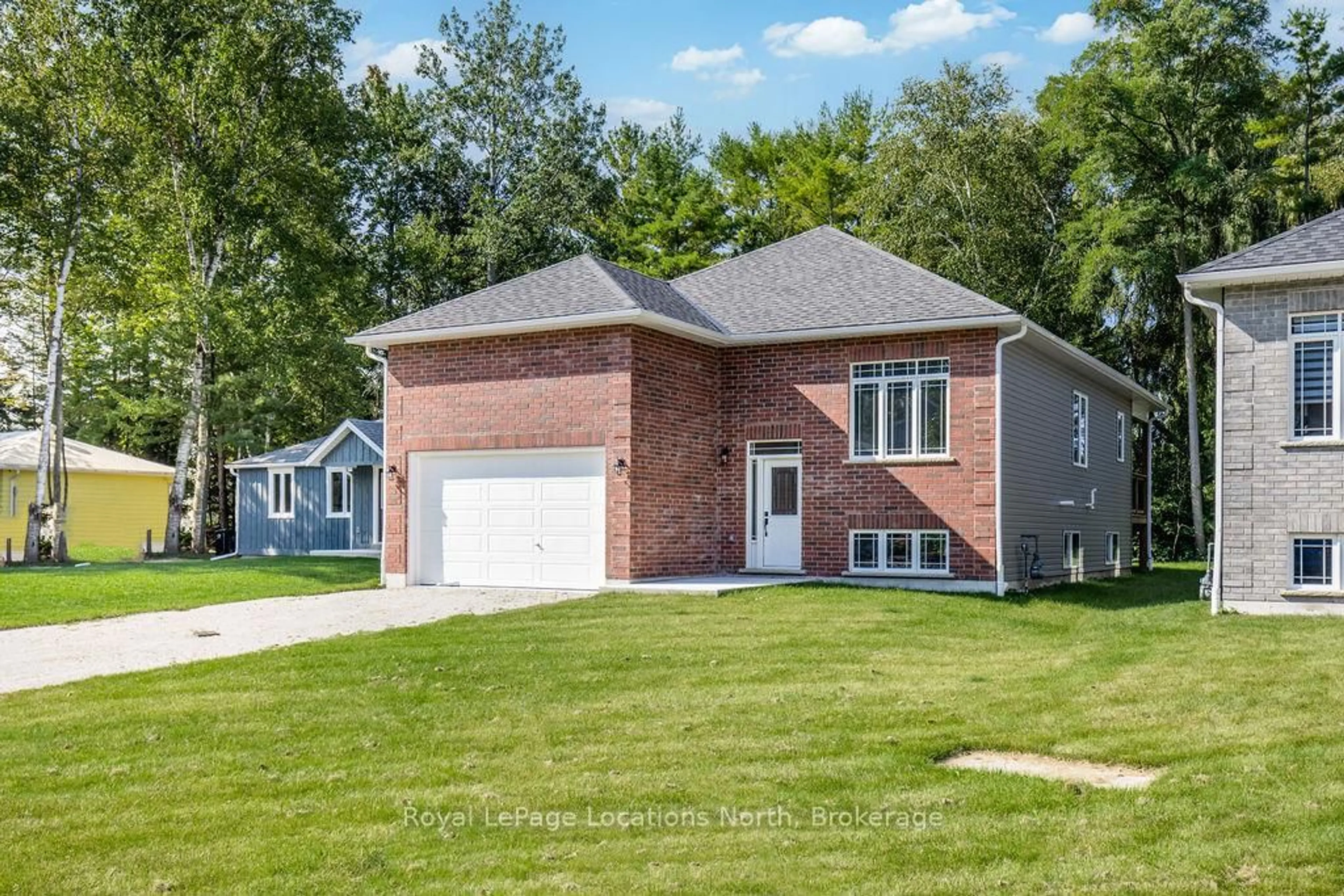 Home with brick exterior material, street for 14 56TH St, Wasaga Beach Ontario L9Z 1W5