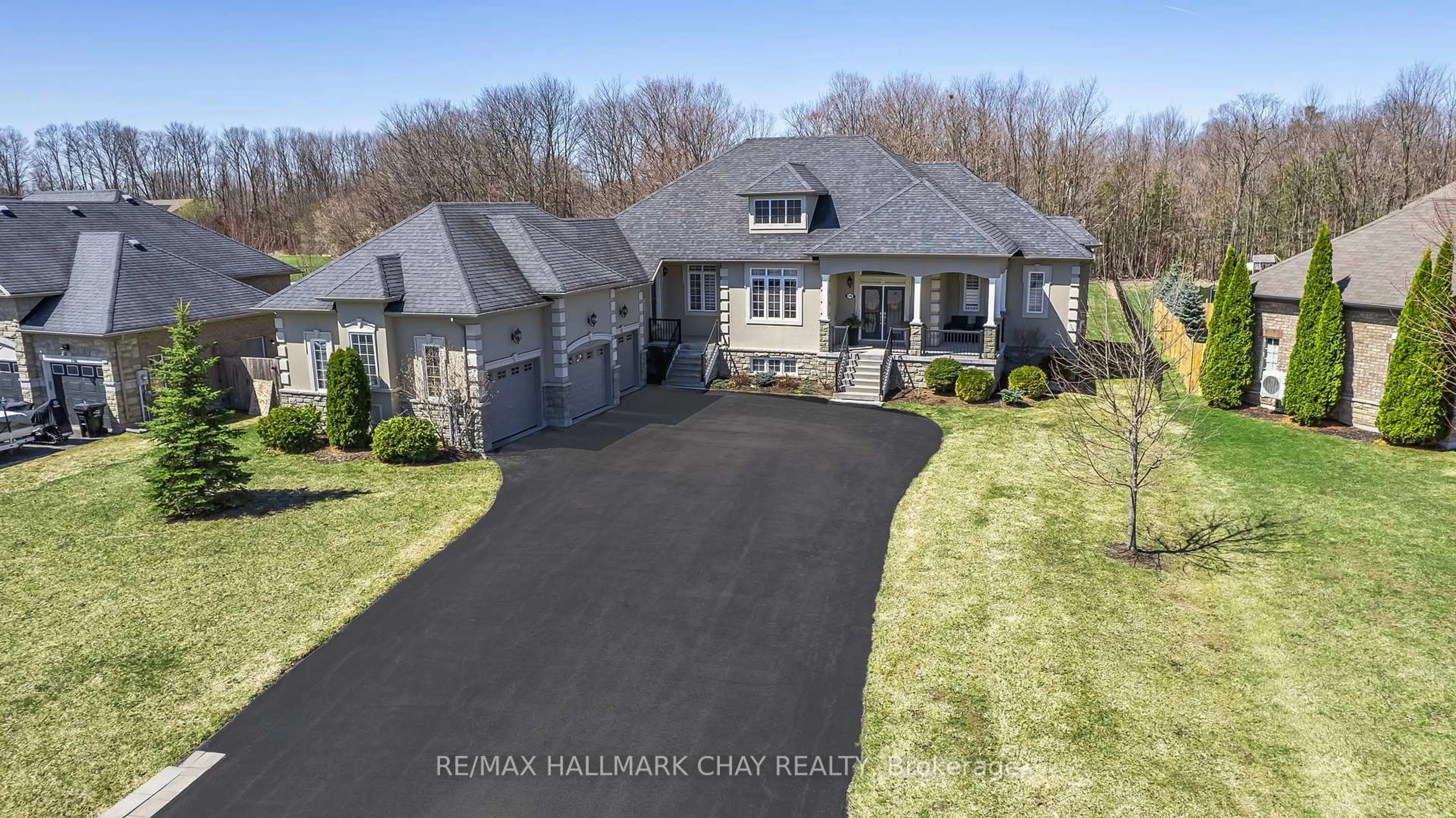 A pic from outside/outdoor area/front of a property/back of a property/a pic from drone, street for 16 Basswood Dr, Wasaga Beach Ontario L9Z 0A9