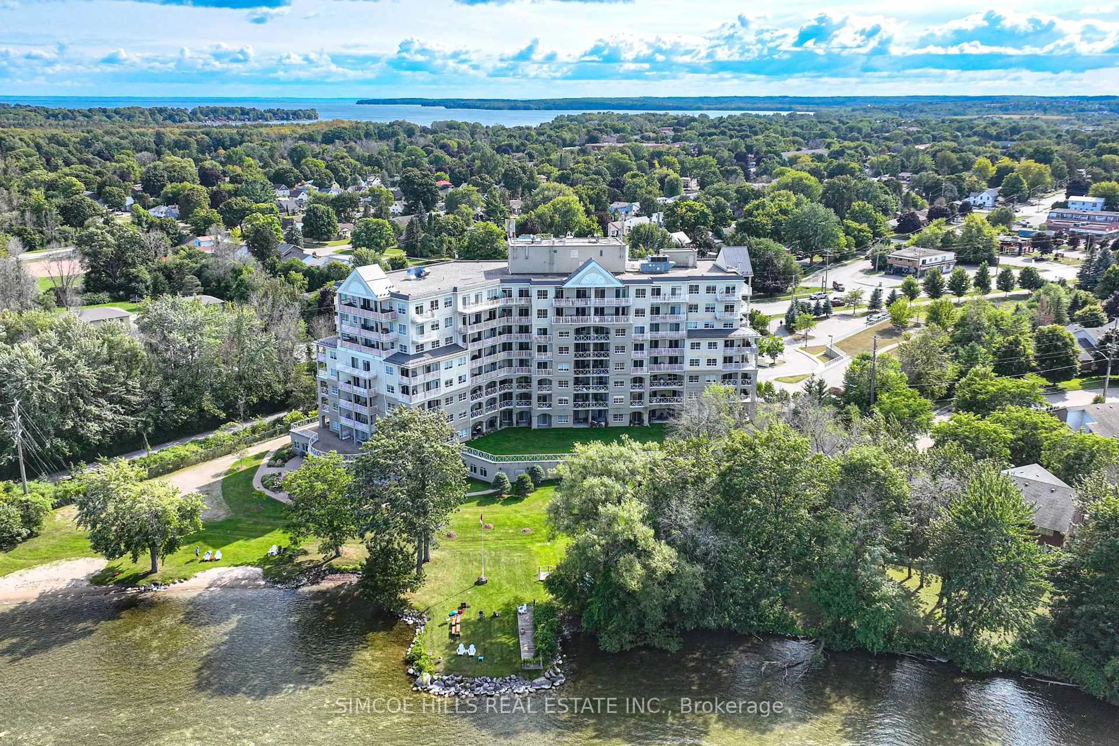 A pic from outside/outdoor area/front of a property/back of a property/a pic from drone, water/lake/river/ocean view for 354 Atherley Rd #408, Orillia Ontario L3V 0B8