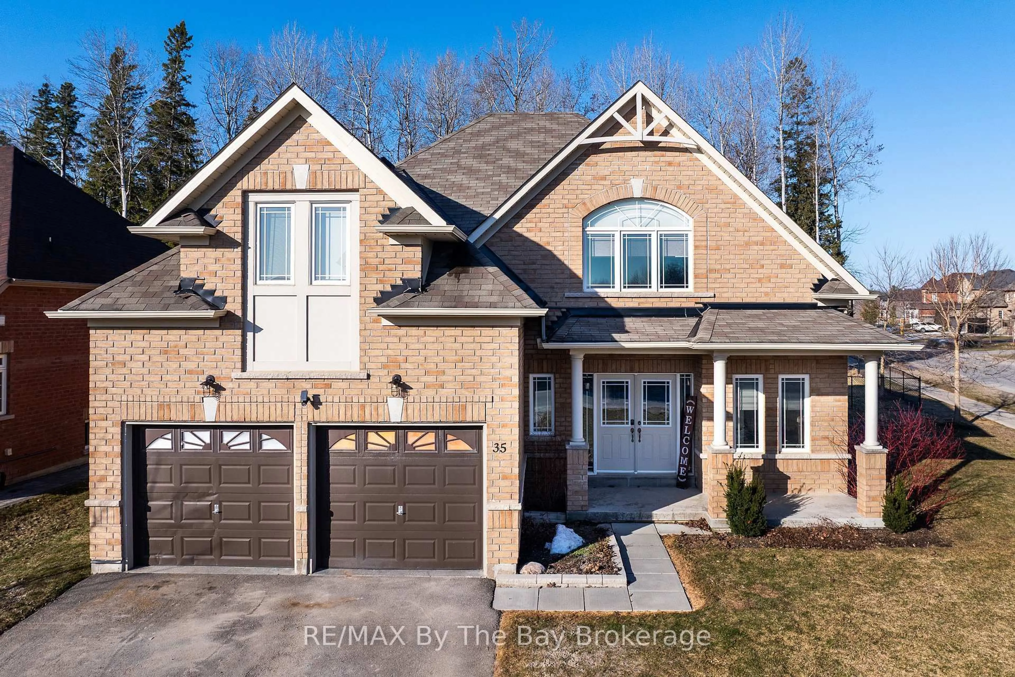 Home with brick exterior material, street for 35 Falvo St, Wasaga Beach Ontario L9Z 0G8