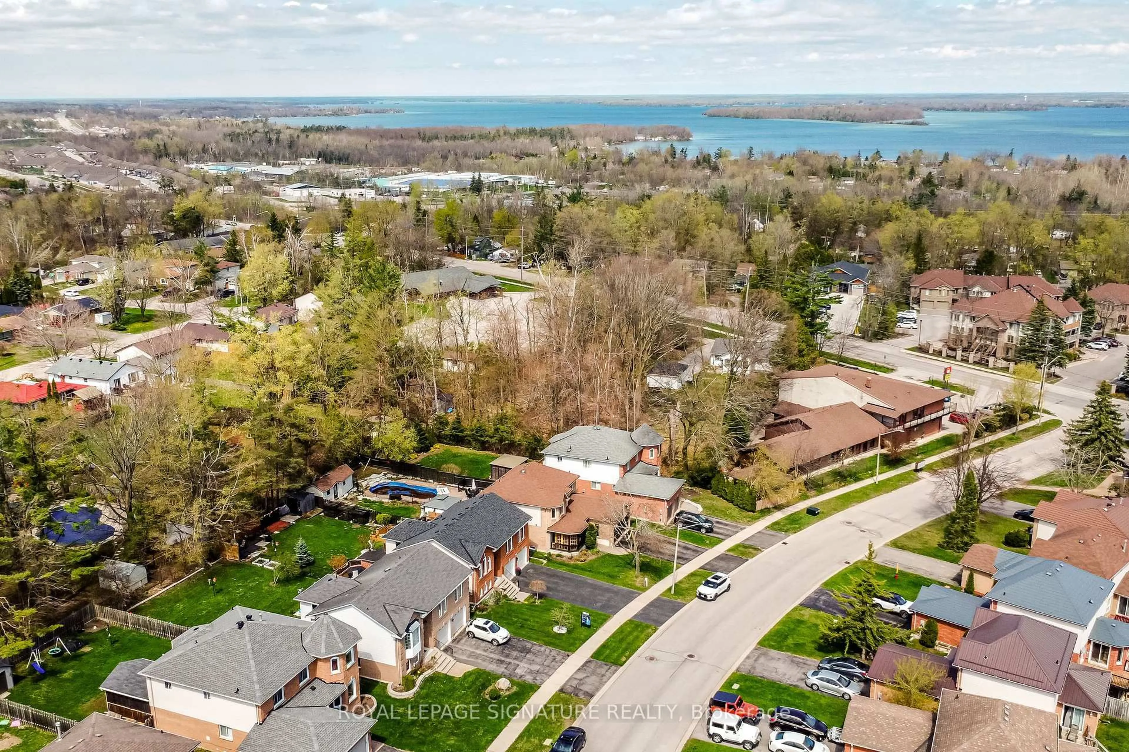 A pic from outside/outdoor area/front of a property/back of a property/a pic from drone, water/lake/river/ocean view for 12 Frontier Ave, Orillia Ontario L3V 7S8