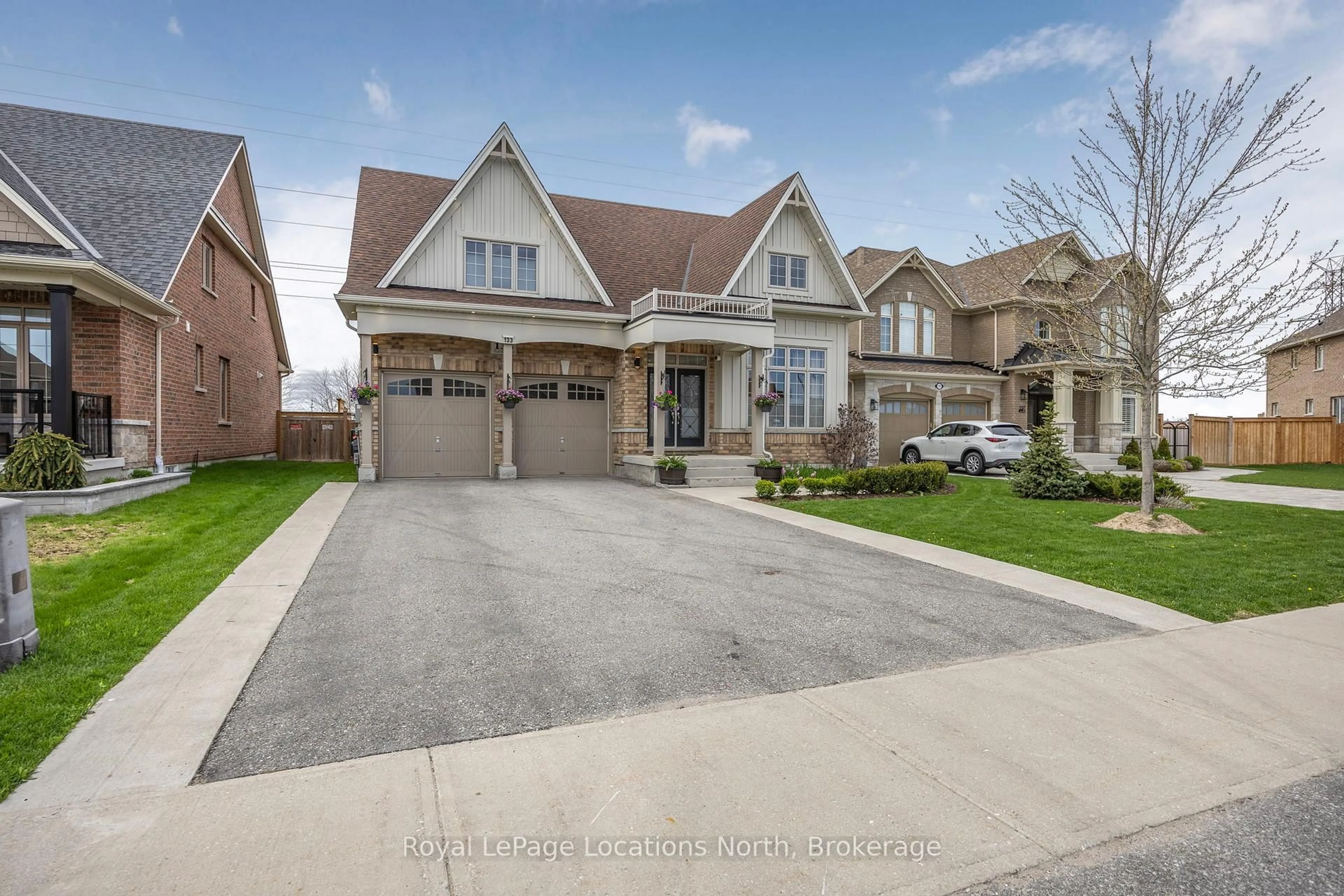 Home with brick exterior material, street for 133 Trail Blvd, Springwater Ontario L9X 0S7