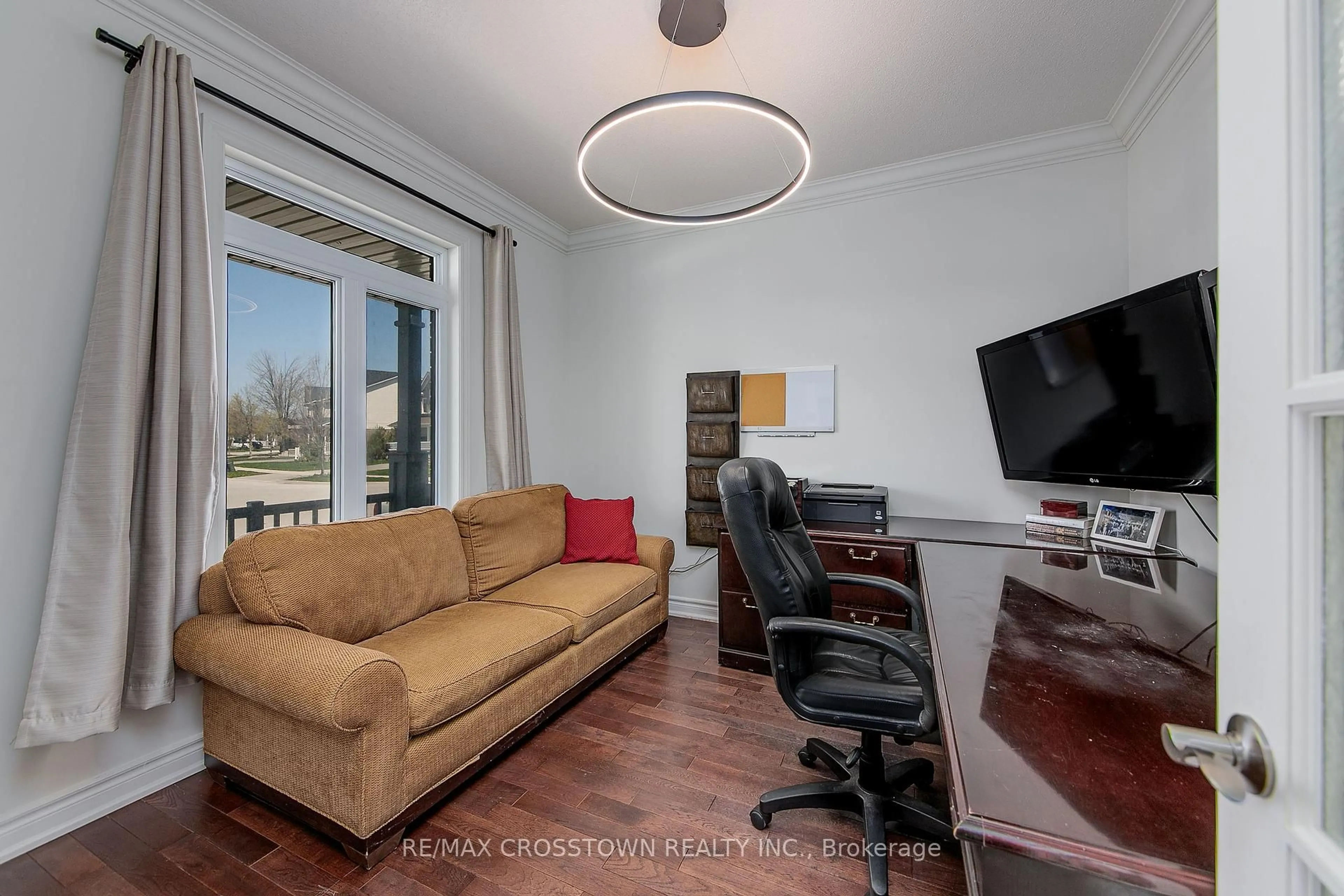 Living room with furniture, wood/laminate floor for 108 Succession Cres, Barrie Ontario L4M 7G6