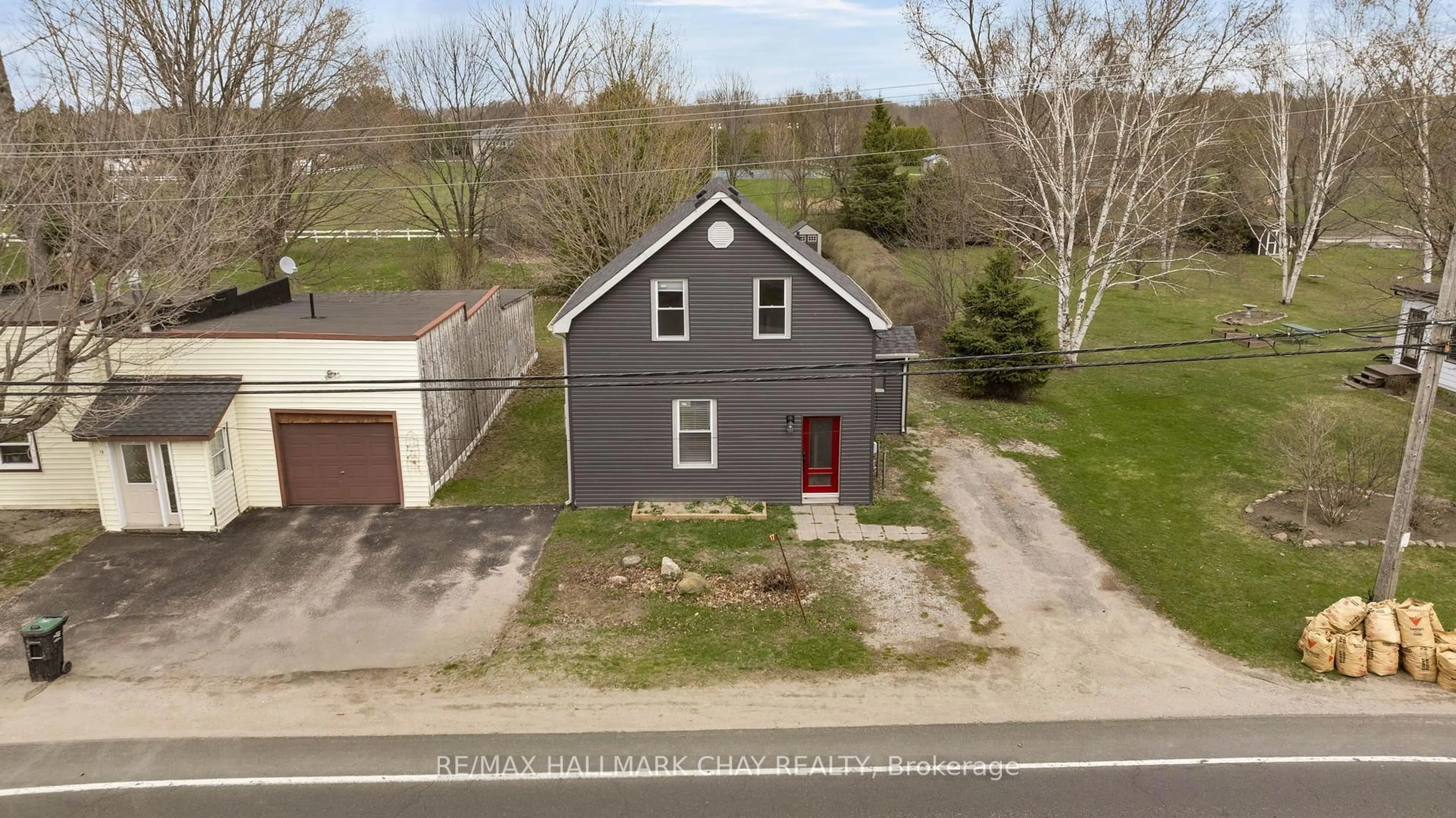 A pic from outside/outdoor area/front of a property/back of a property/a pic from drone, street for 17 County Road 6 Rd, Tiny Ontario L0L 2J0