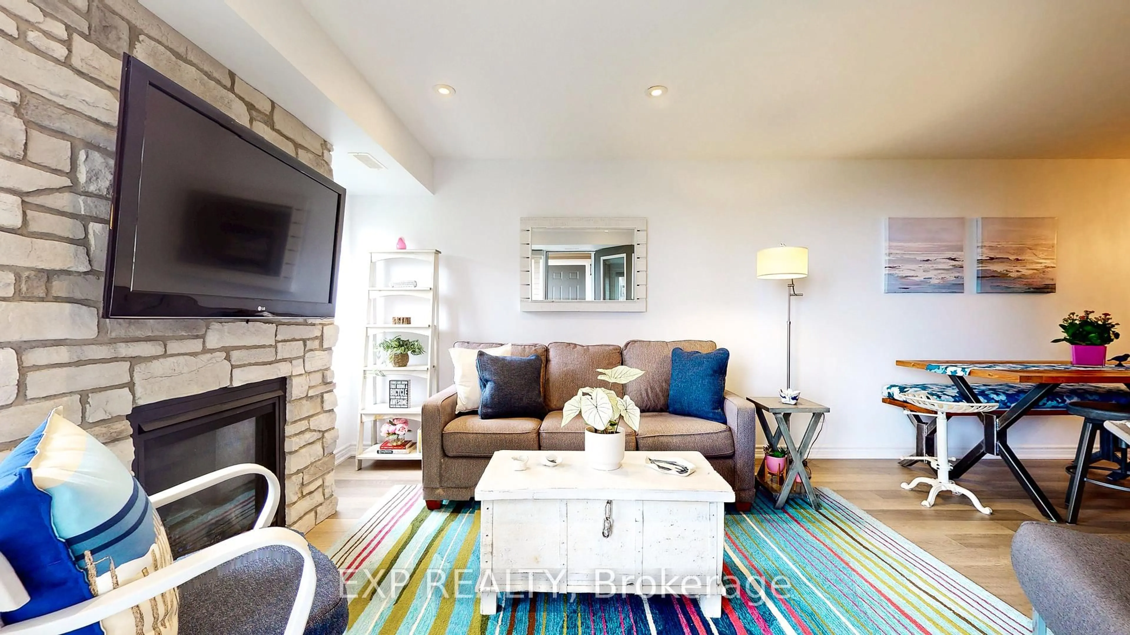 Living room with furniture, wood/laminate floor for 5 Anchorage Cres #202, Collingwood Ontario L9Y 0Y6