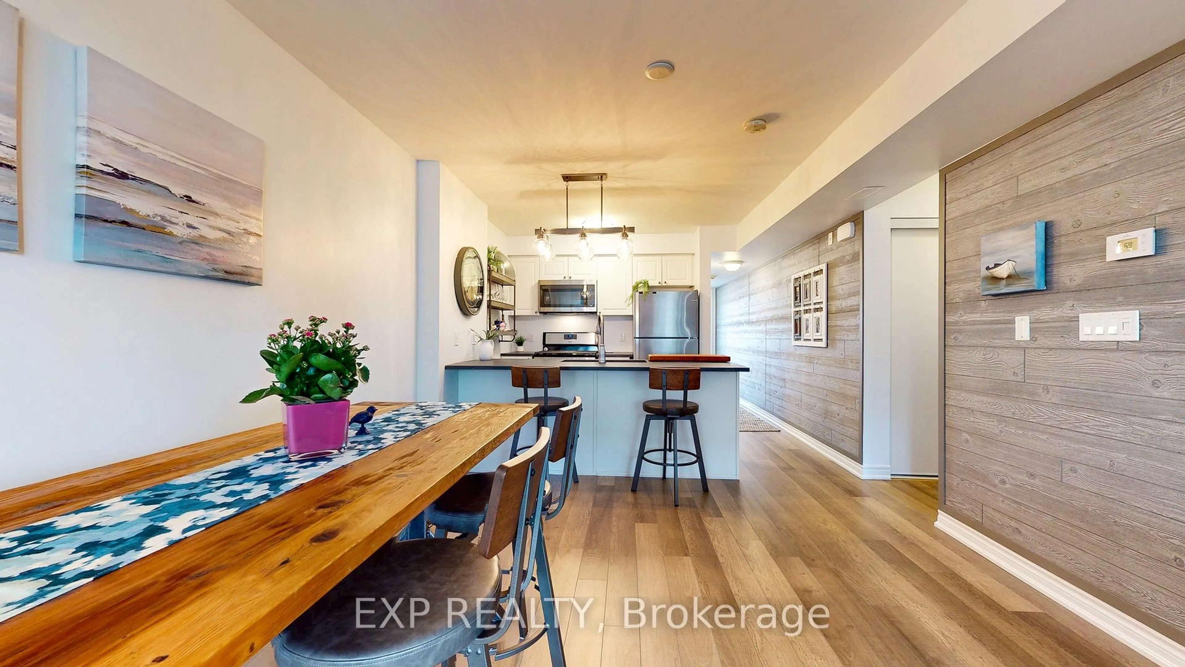 Open concept kitchen, wood/laminate floor for 5 Anchorage Cres #202, Collingwood Ontario L9Y 0Y6