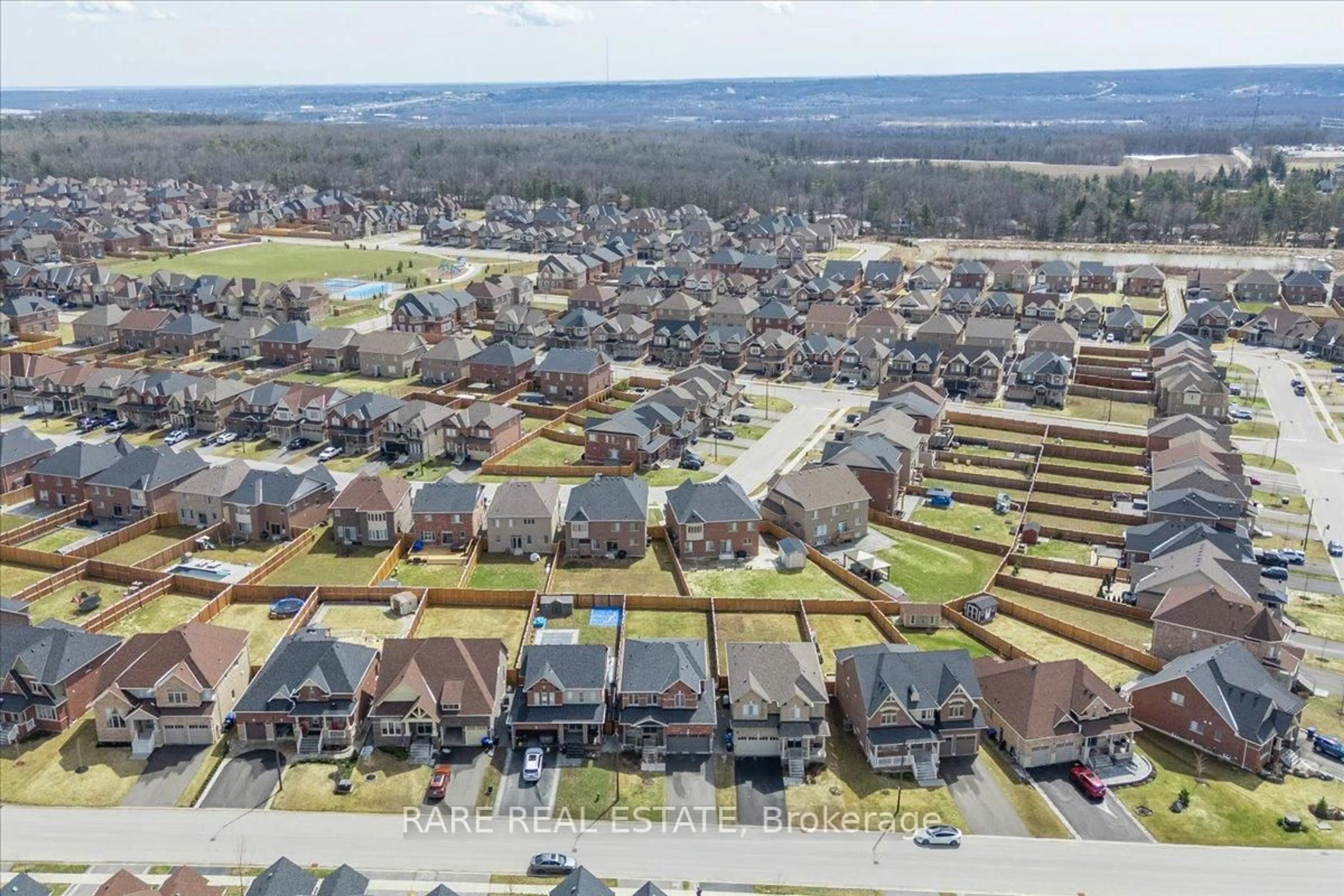 A pic from outside/outdoor area/front of a property/back of a property/a pic from drone, street for 82 Rugman Cres, Springwater Ontario L9X 2A4