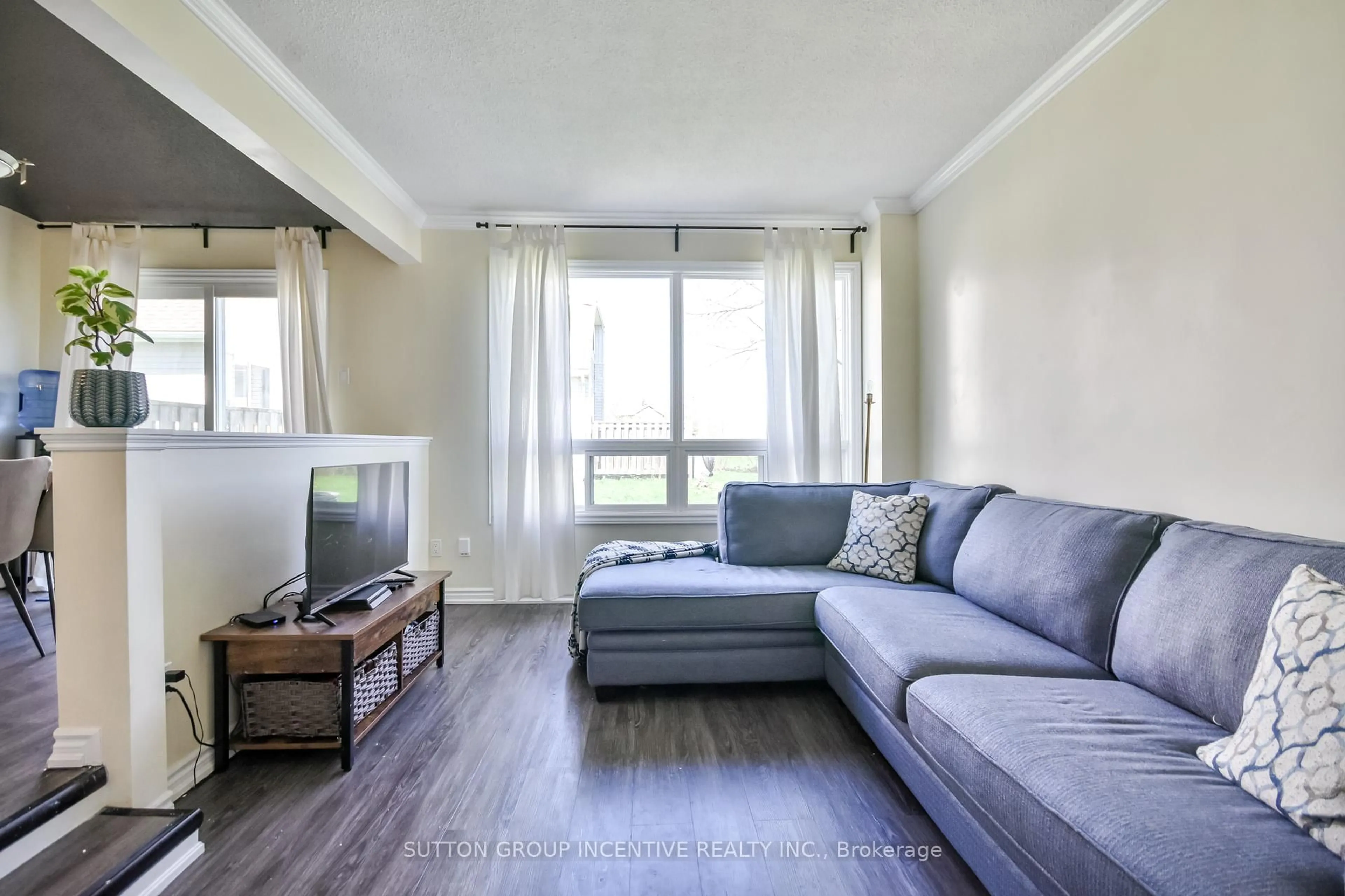 Living room with furniture, wood/laminate floor for 12 Lankin Blvd #39, Orillia Ontario L3V 6T2