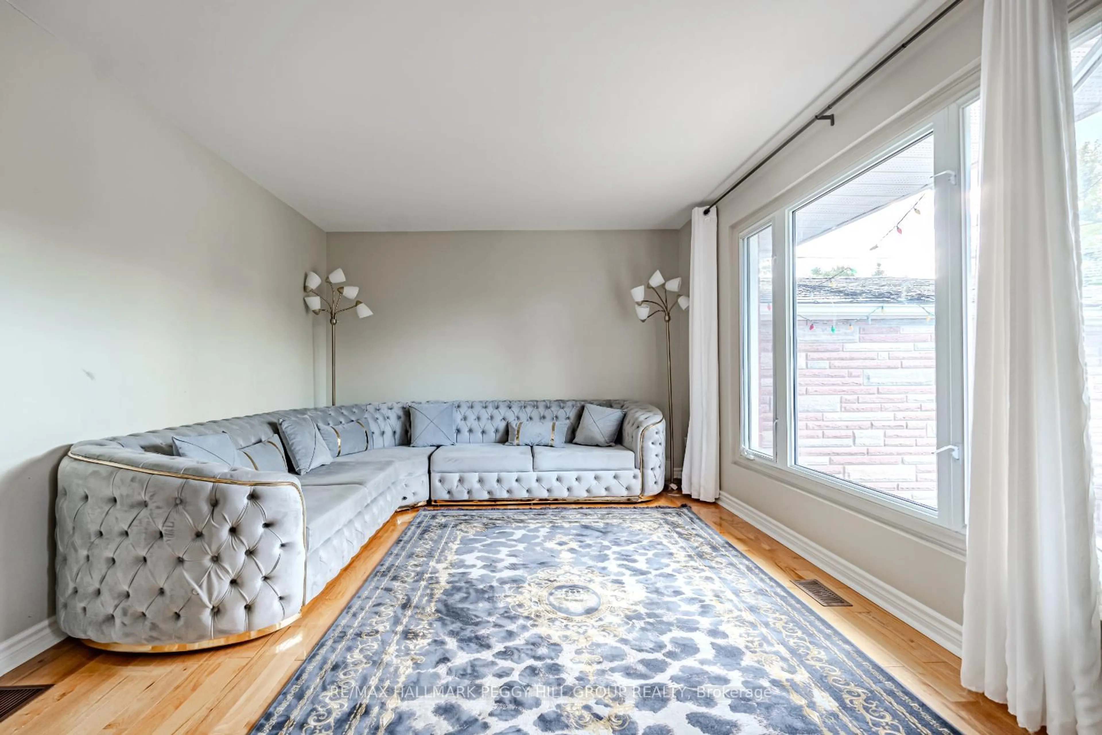 Living room with furniture, carpet floor for 215 Phillips St, Barrie Ontario L4N 3V2