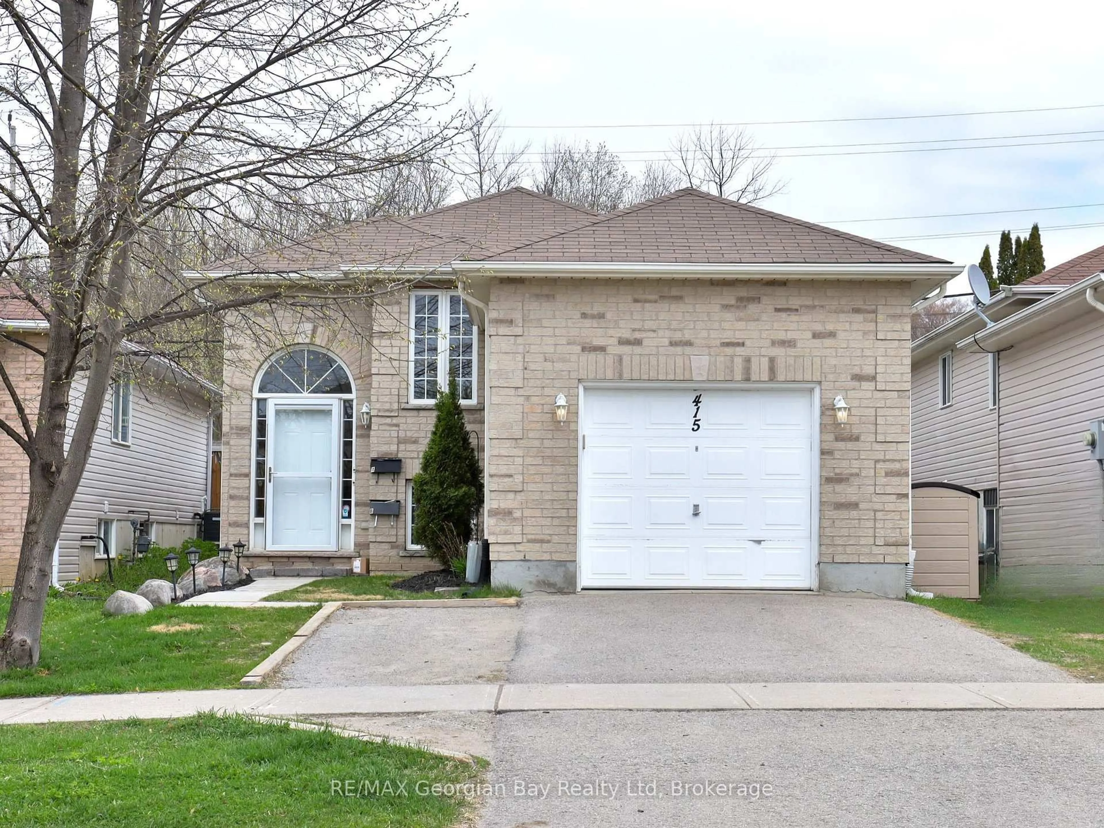 Home with brick exterior material, street for 415 Irwin St, Midland Ontario L4R 2V6