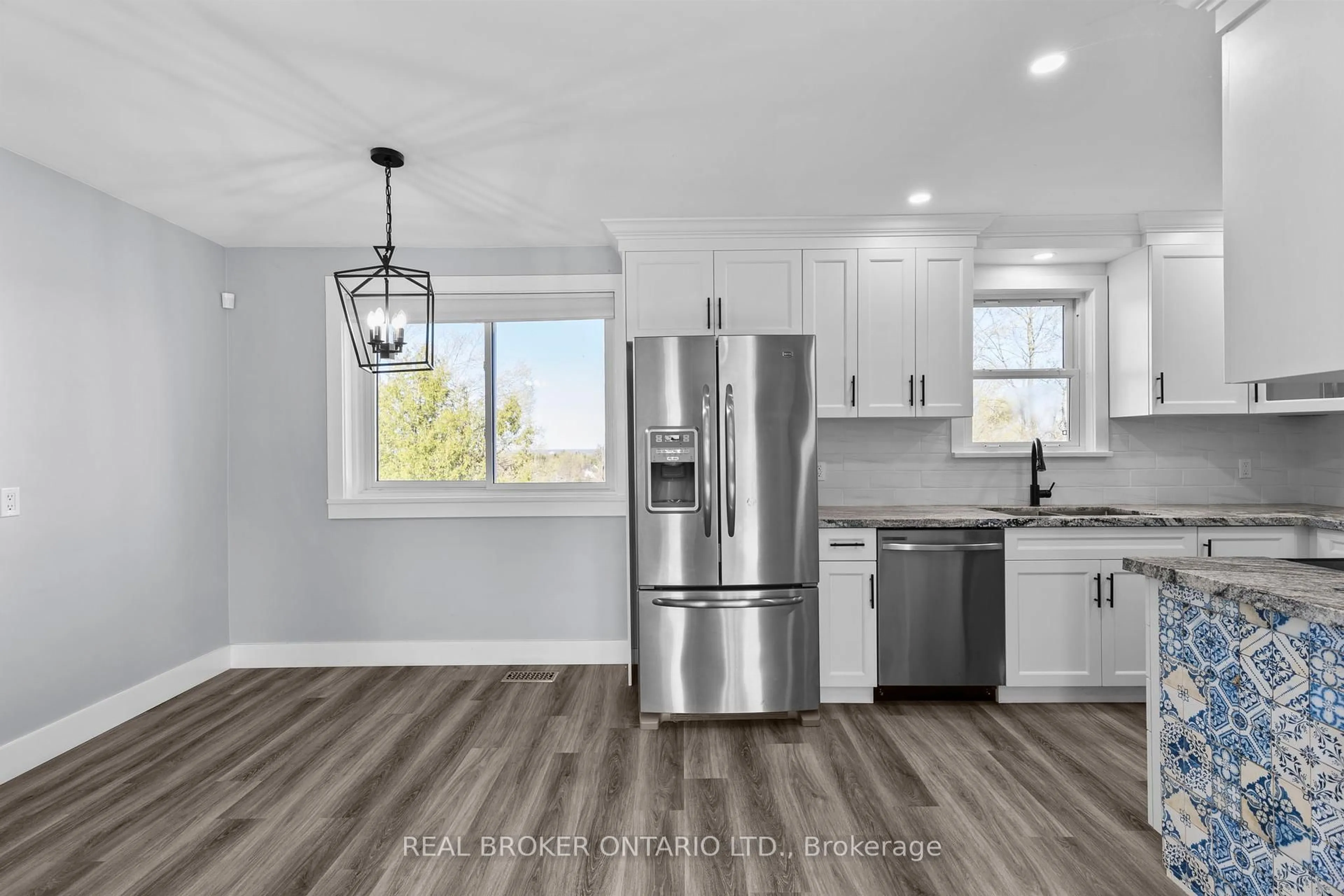 Open concept kitchen, wood/laminate floor for 42 Charles Rd, Orillia Ontario L3V 3H4