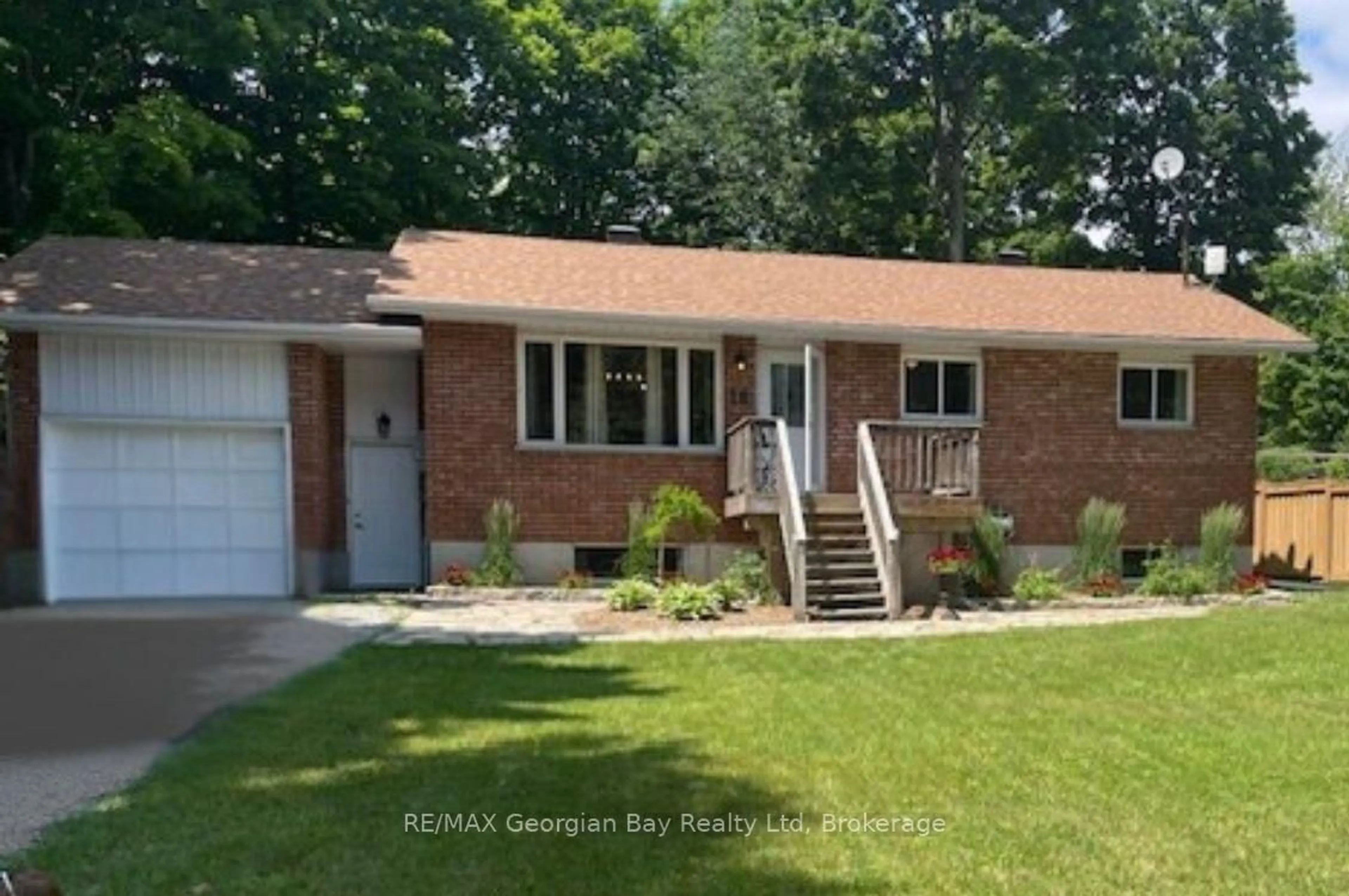 Home with brick exterior material, street for 16 Mundy Ave, Tiny Ontario L9M 0B5