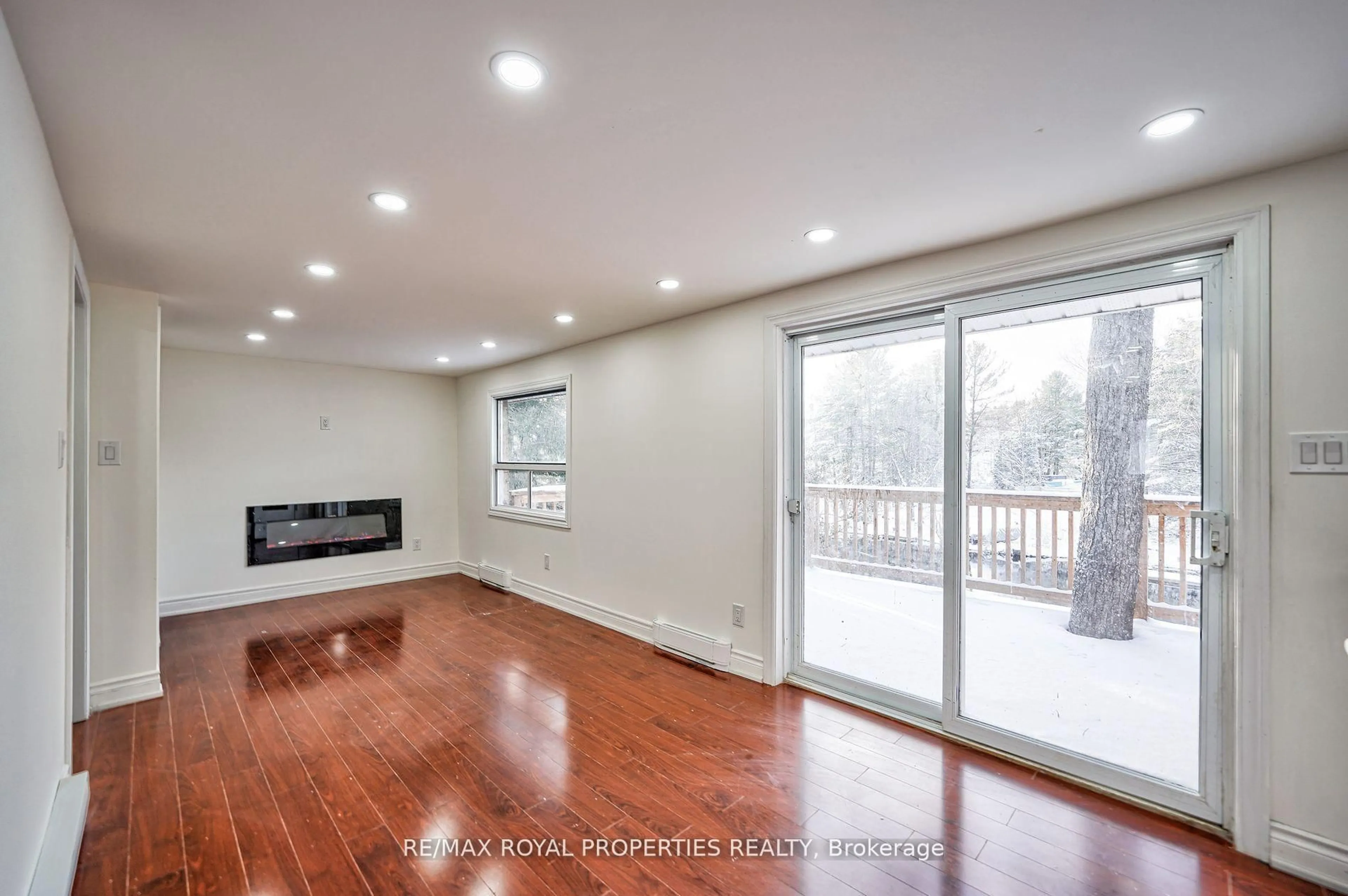 Living room with furniture, wood/laminate floor for 8144 Laidlaw Ave, Ramara Ontario L0K 2B0