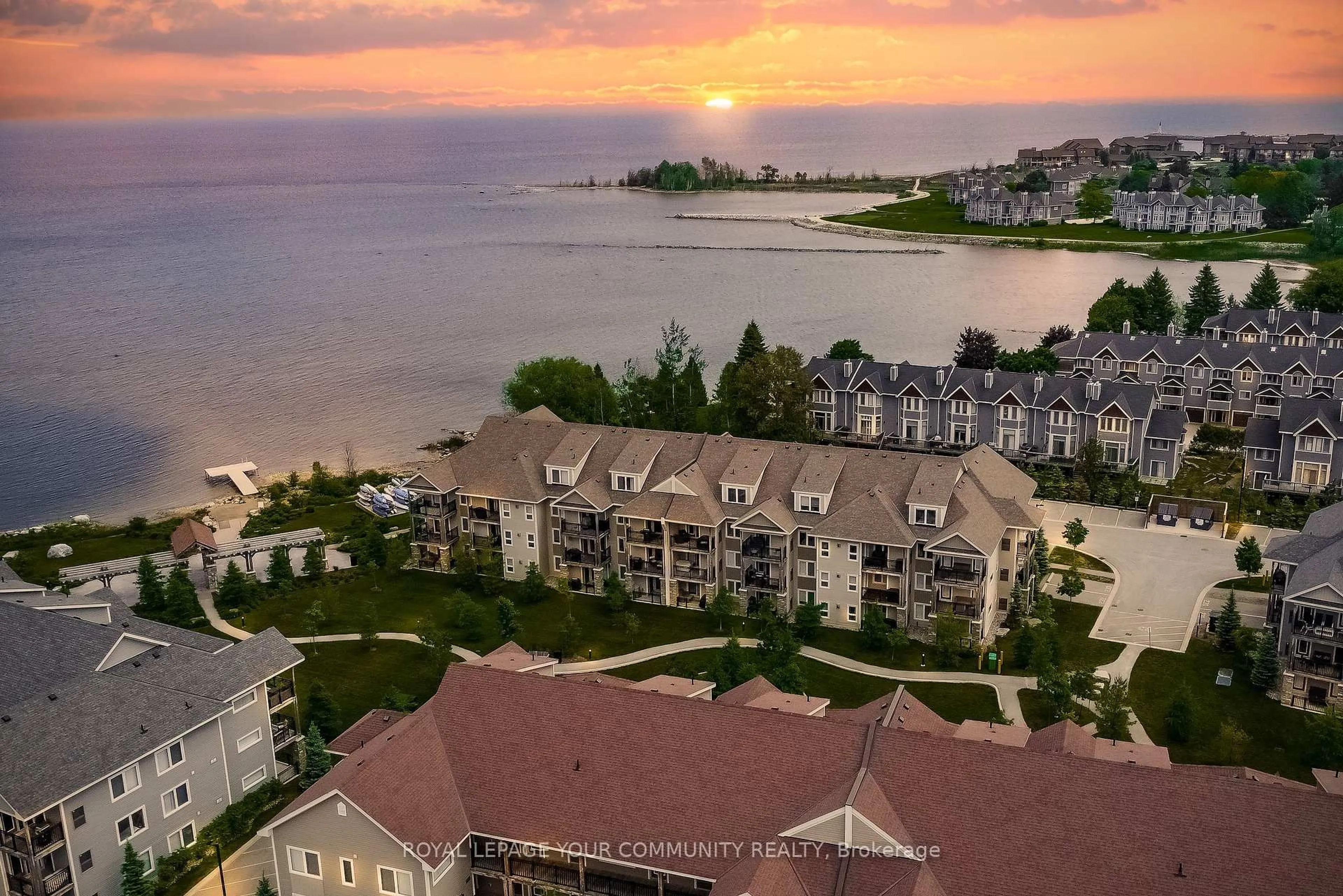 A pic from outside/outdoor area/front of a property/back of a property/a pic from drone, water/lake/river/ocean view for 4 Cove Crt #302, Collingwood Ontario L9Y 0Y6