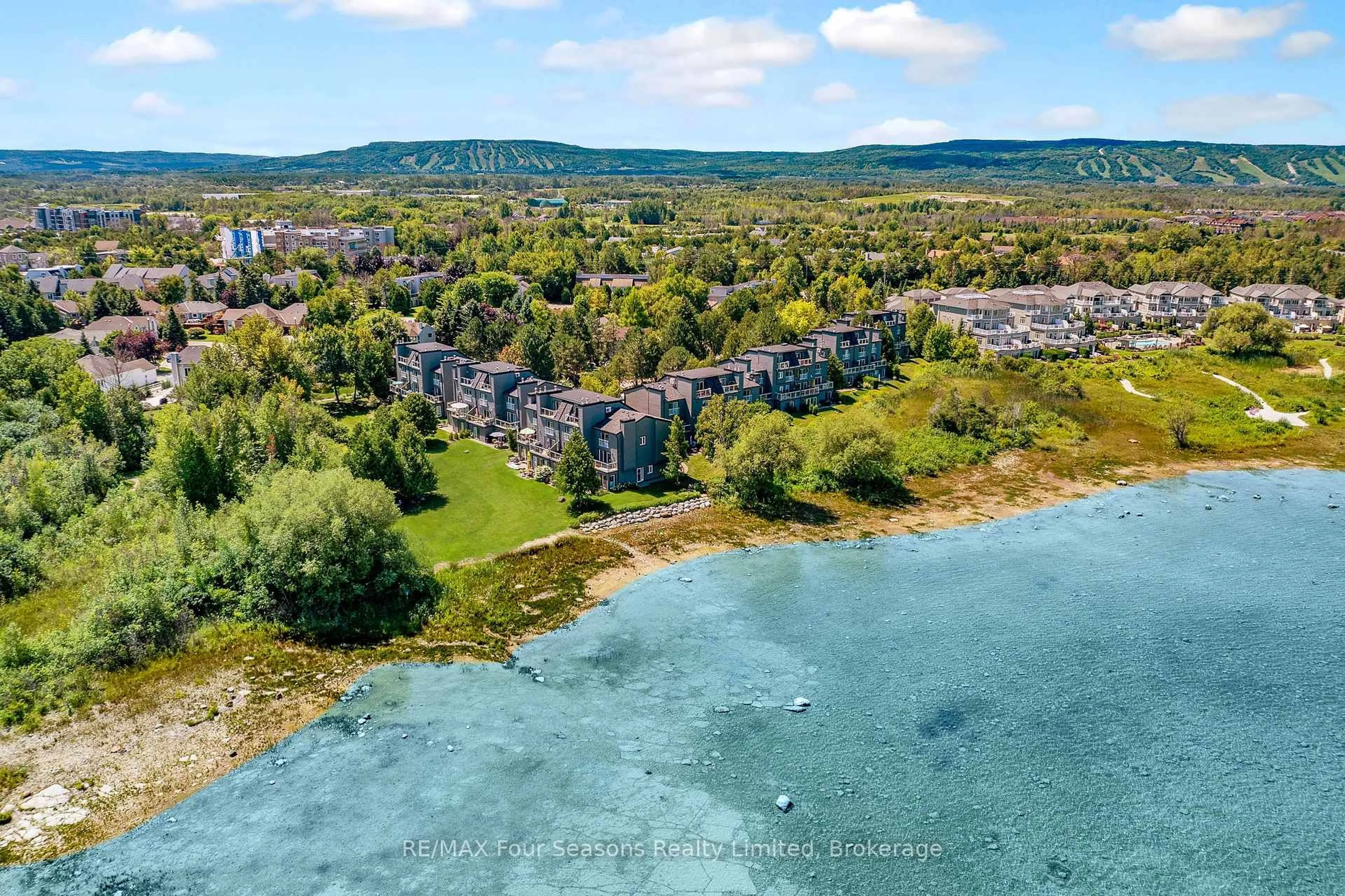 A pic from outside/outdoor area/front of a property/back of a property/a pic from drone, water/lake/river/ocean view for 44 Trott Blvd #18, Collingwood Ontario L9Y 5B7
