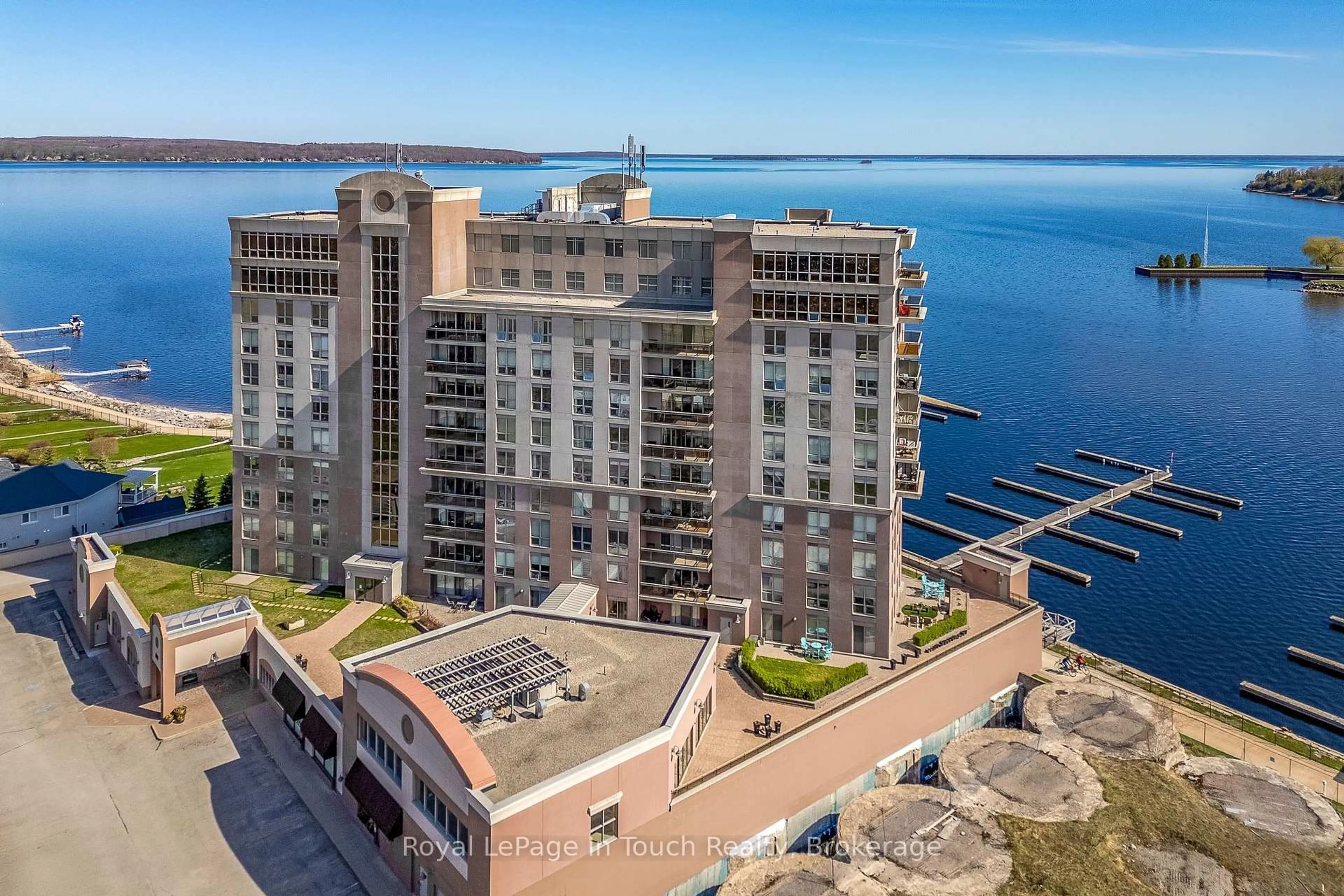 A pic from outside/outdoor area/front of a property/back of a property/a pic from drone, water/lake/river/ocean view for 699 Aberdeen Blvd #UPH3, Midland Ontario L4R 5P2