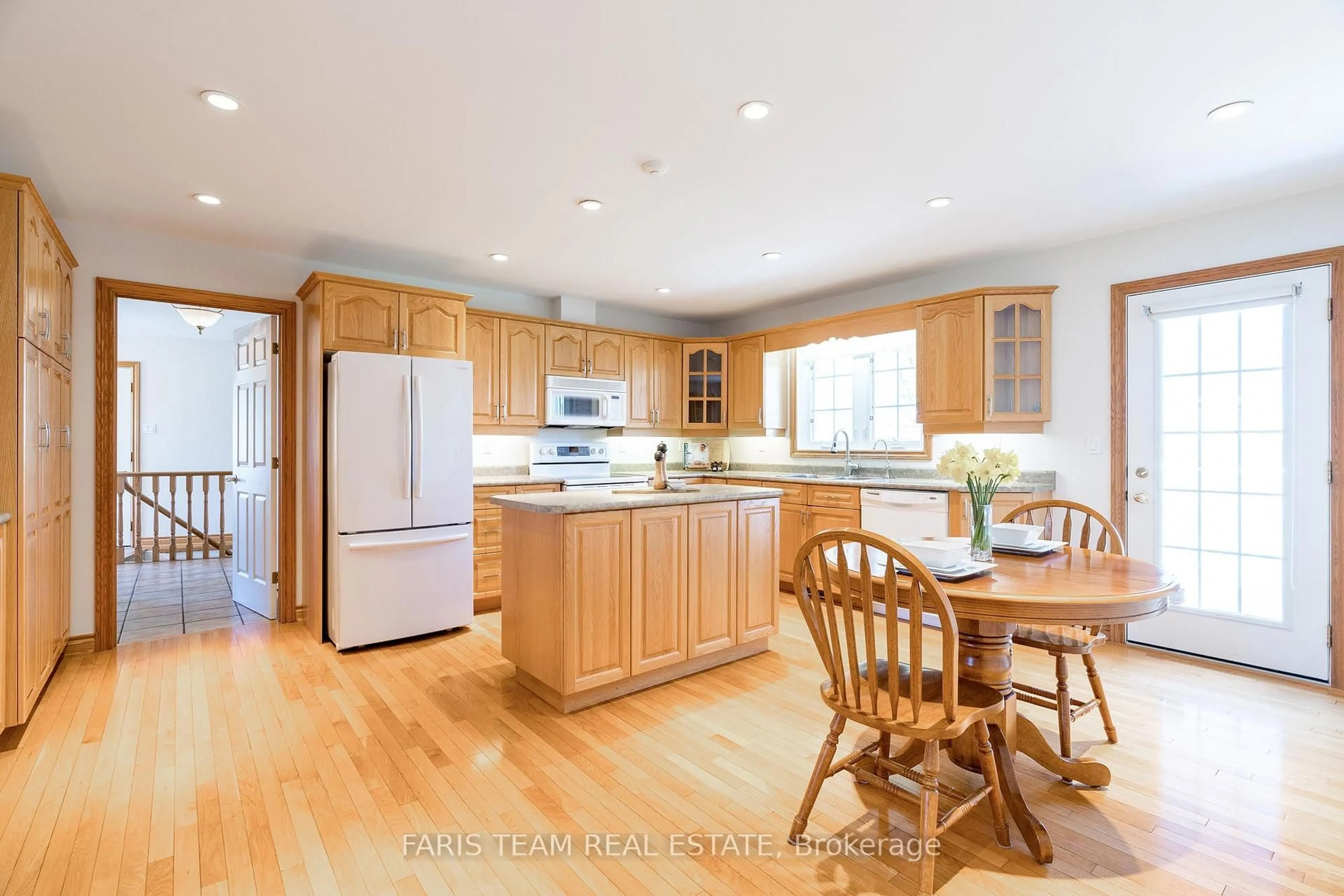 Open concept kitchen, wood/laminate floor for 8485 Highway 93 N/A, Tiny Ontario L4R 0E3