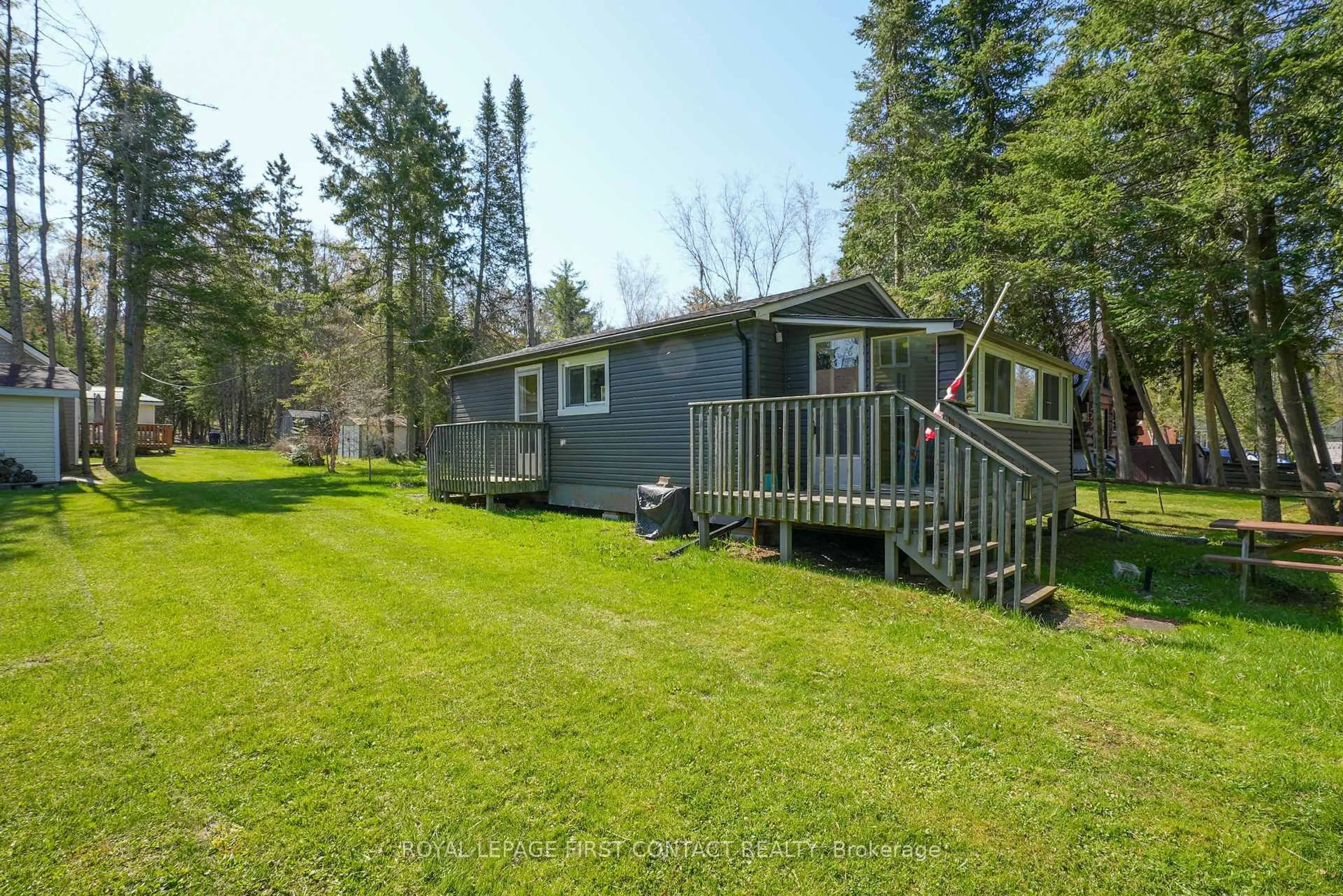 A pic from outside/outdoor area/front of a property/back of a property/a pic from drone, water/lake/river/ocean view for 6 Buttercup Lane, Springwater Ontario L0L 1P0