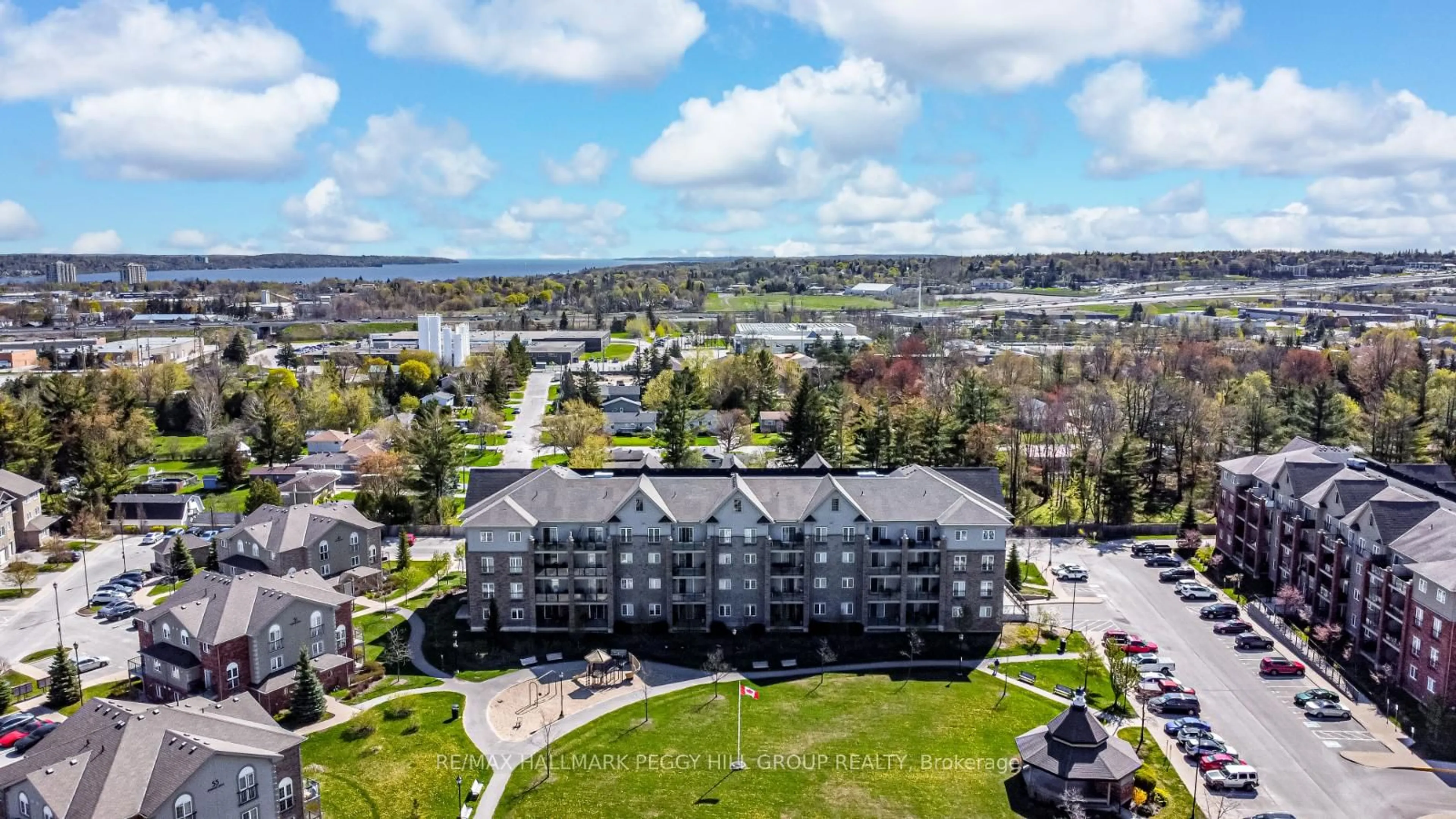 A pic from outside/outdoor area/front of a property/back of a property/a pic from drone, water/lake/river/ocean view for 45 Ferndale Dr #305, Barrie Ontario L4N 5W7