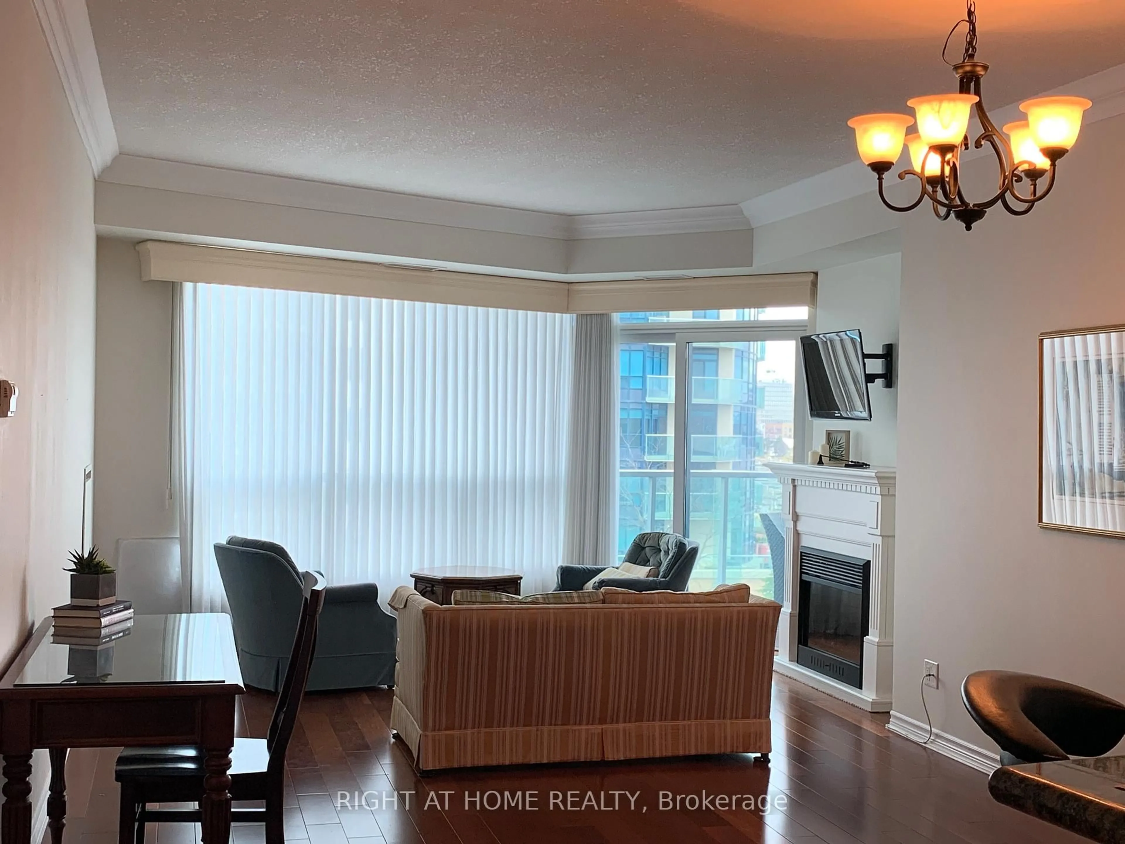 Living room with furniture, wood/laminate floor for 37 Ellen St #504, Barrie Ontario L4N 6G2