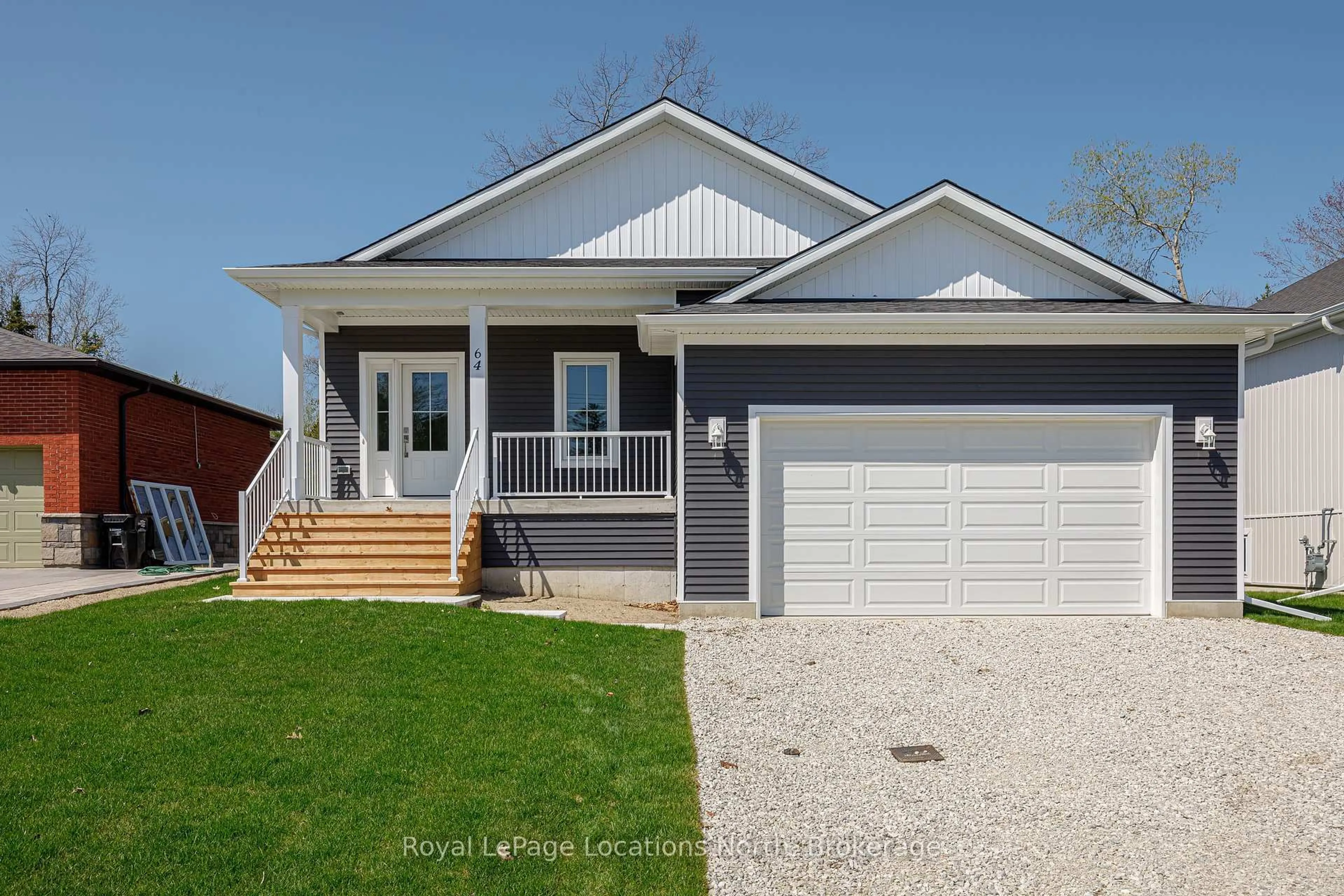 Home with vinyl exterior material, street for 64 52nd St, Wasaga Beach Ontario L9Z 1W8