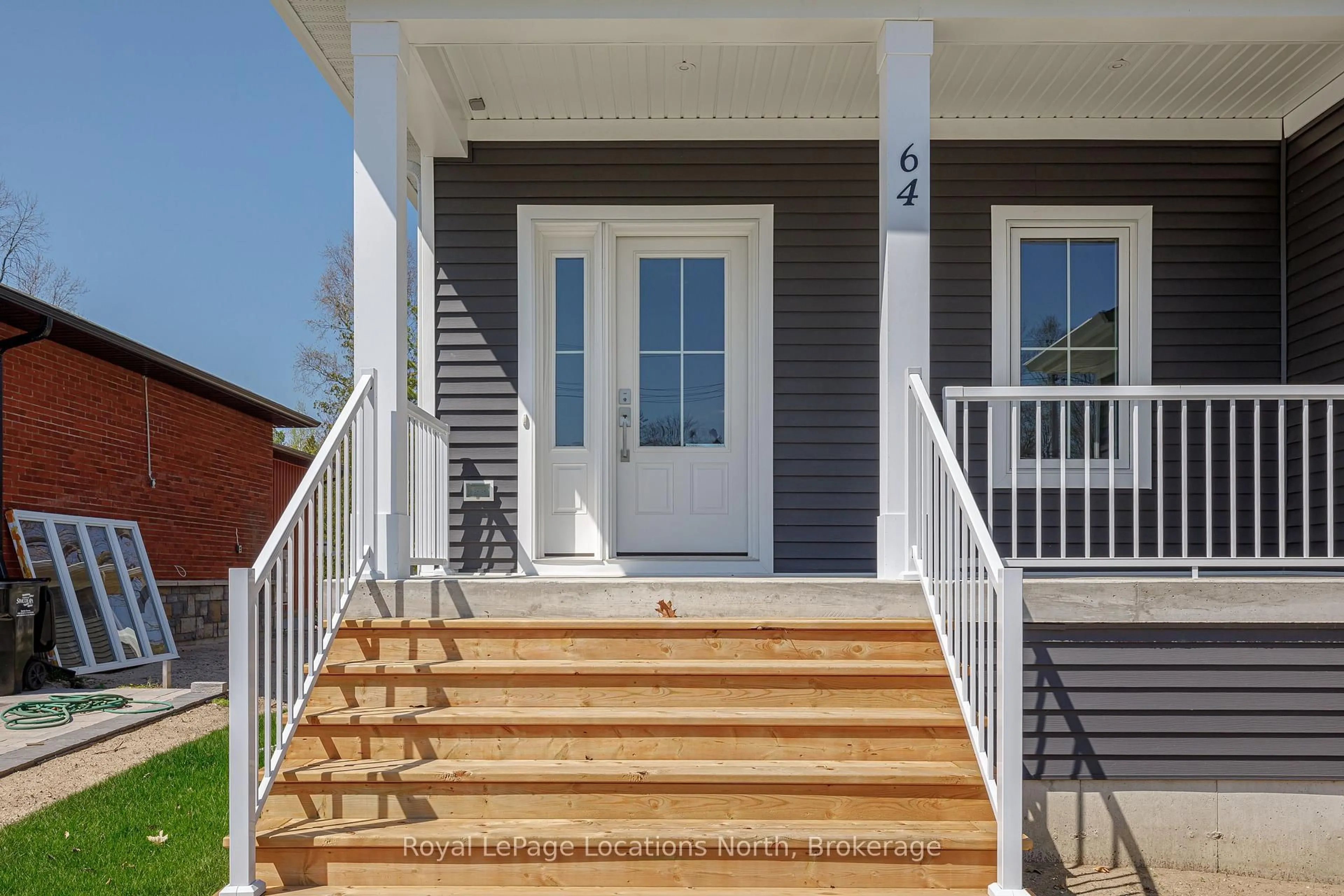 Home with vinyl exterior material, street for 64 52nd St, Wasaga Beach Ontario L9Z 1W8