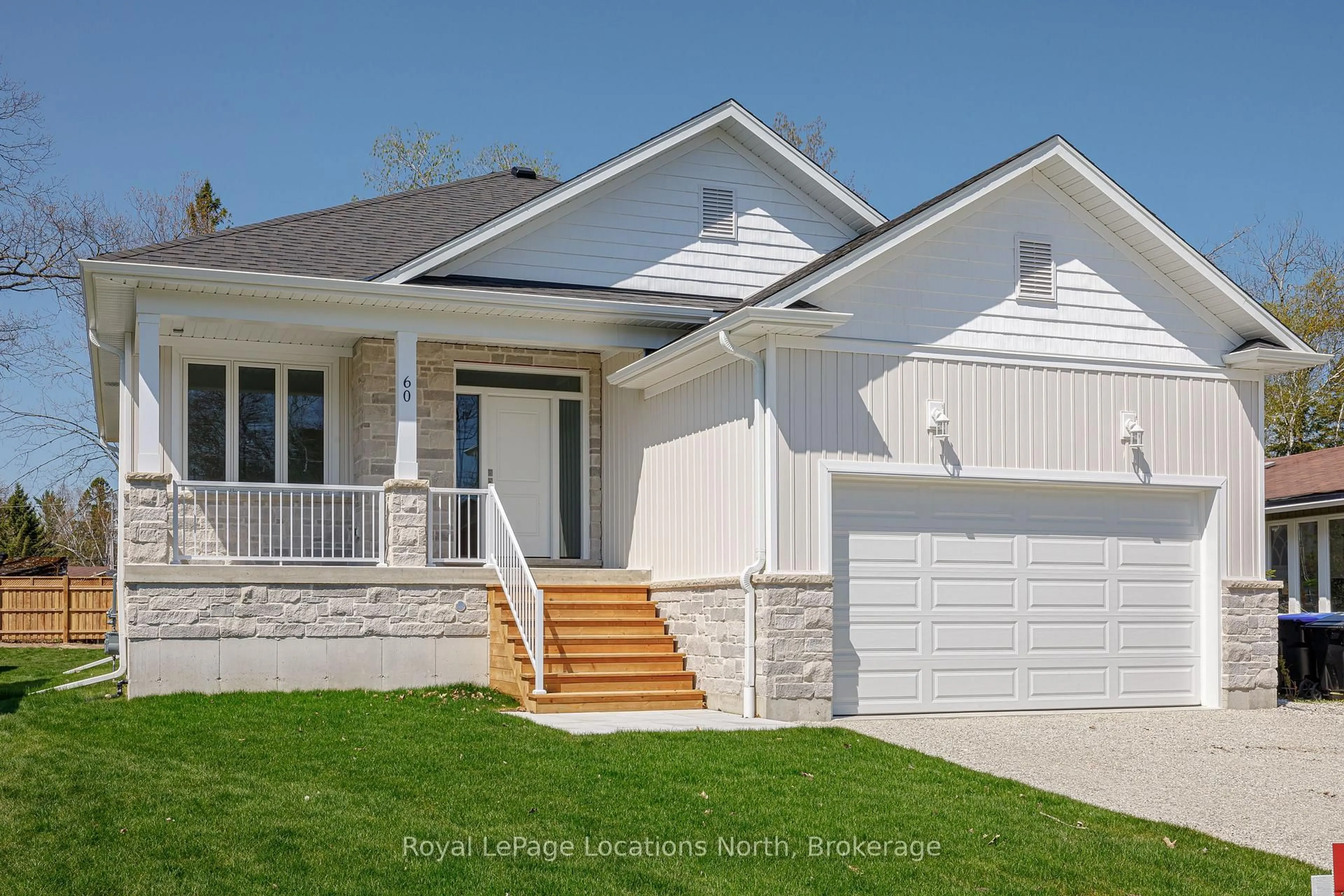Home with vinyl exterior material, street for 60 52nd St, Wasaga Beach Ontario L0M 1P0