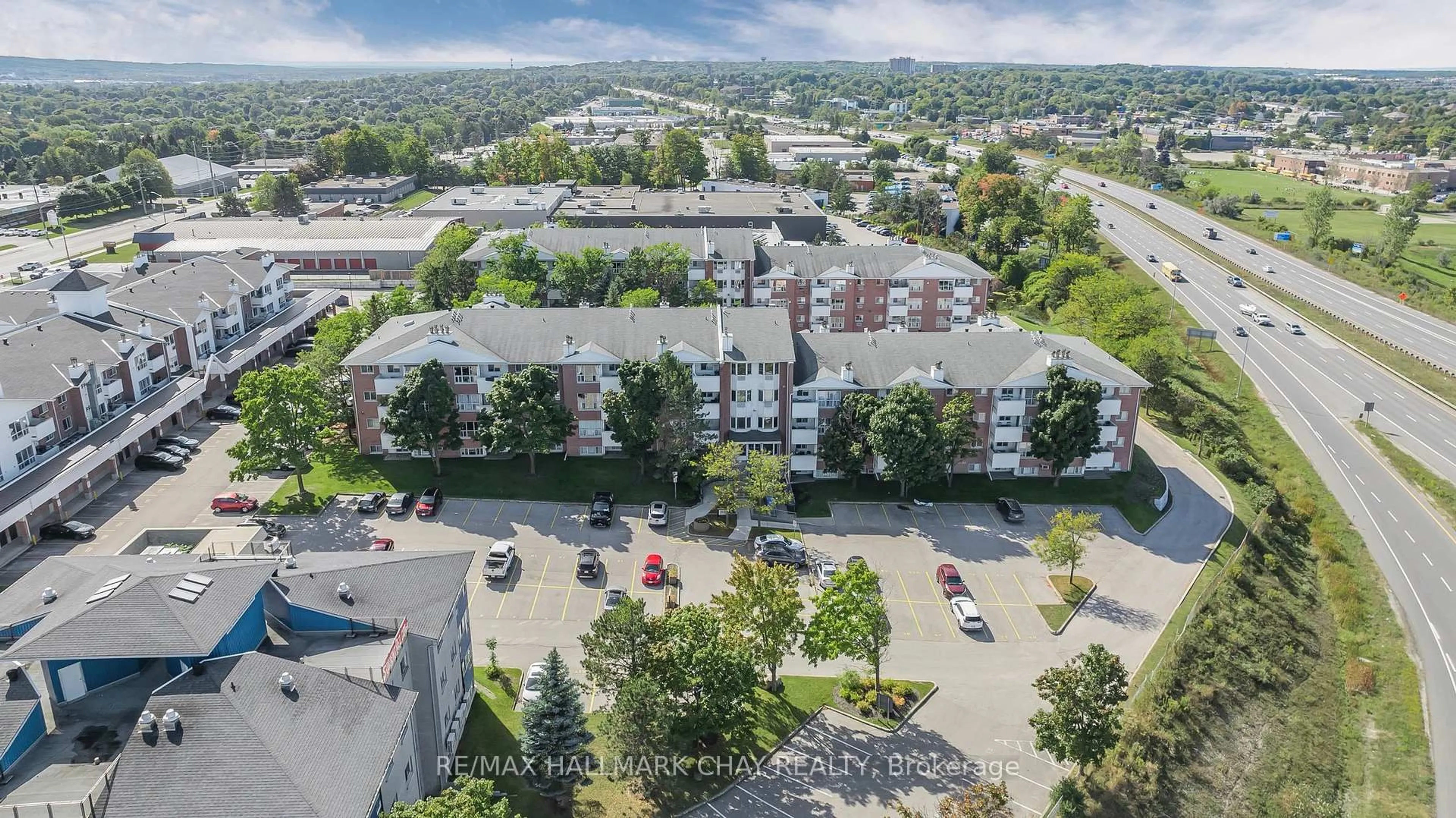 A pic from outside/outdoor area/front of a property/back of a property/a pic from drone, city buildings view from balcony for 126 Bell Farm Rd #209, Barrie Ontario L4M 6J3