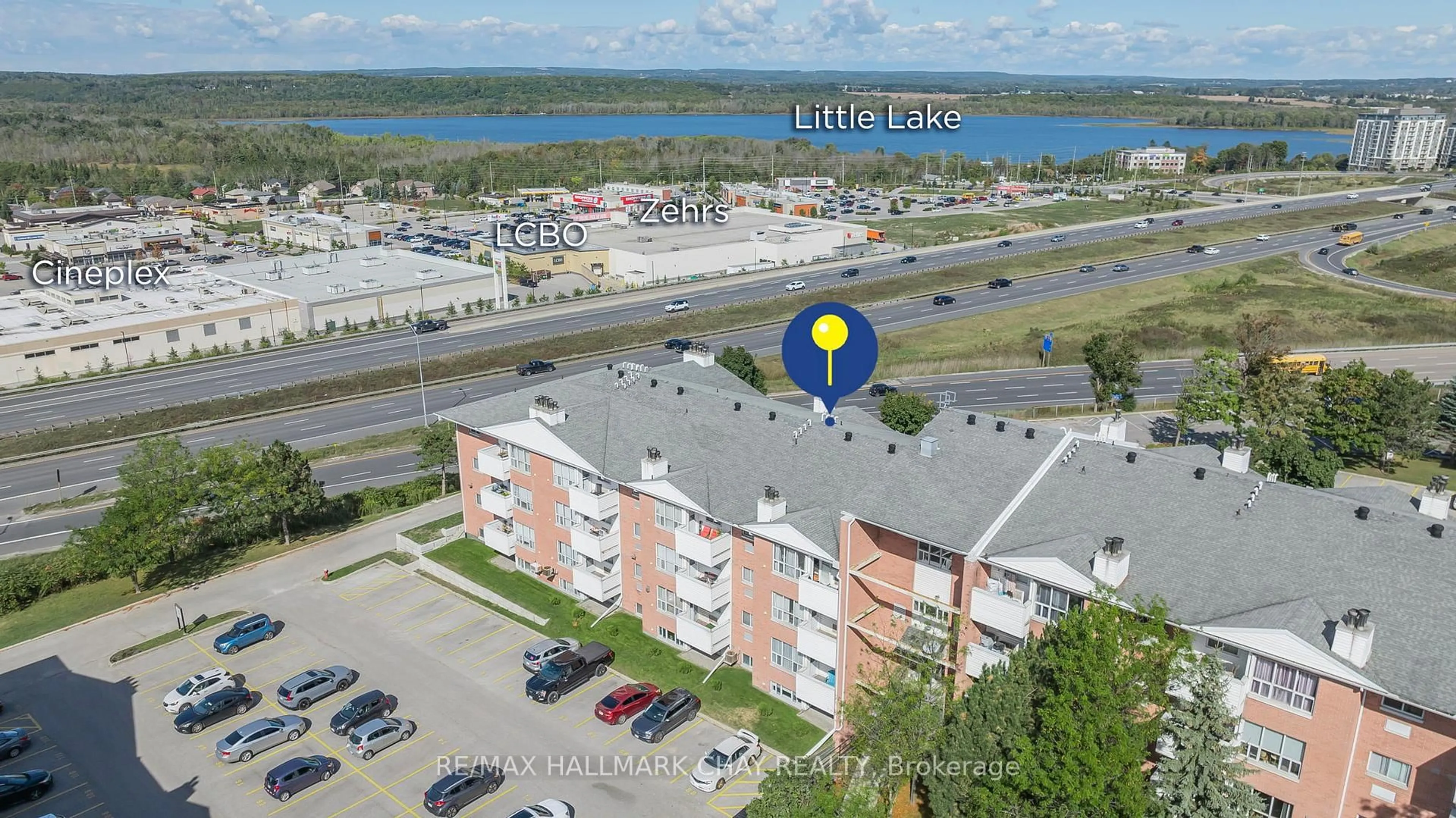 A pic from outside/outdoor area/front of a property/back of a property/a pic from drone, water/lake/river/ocean view for 126 Bell Farm Rd #209, Barrie Ontario L4M 6J3