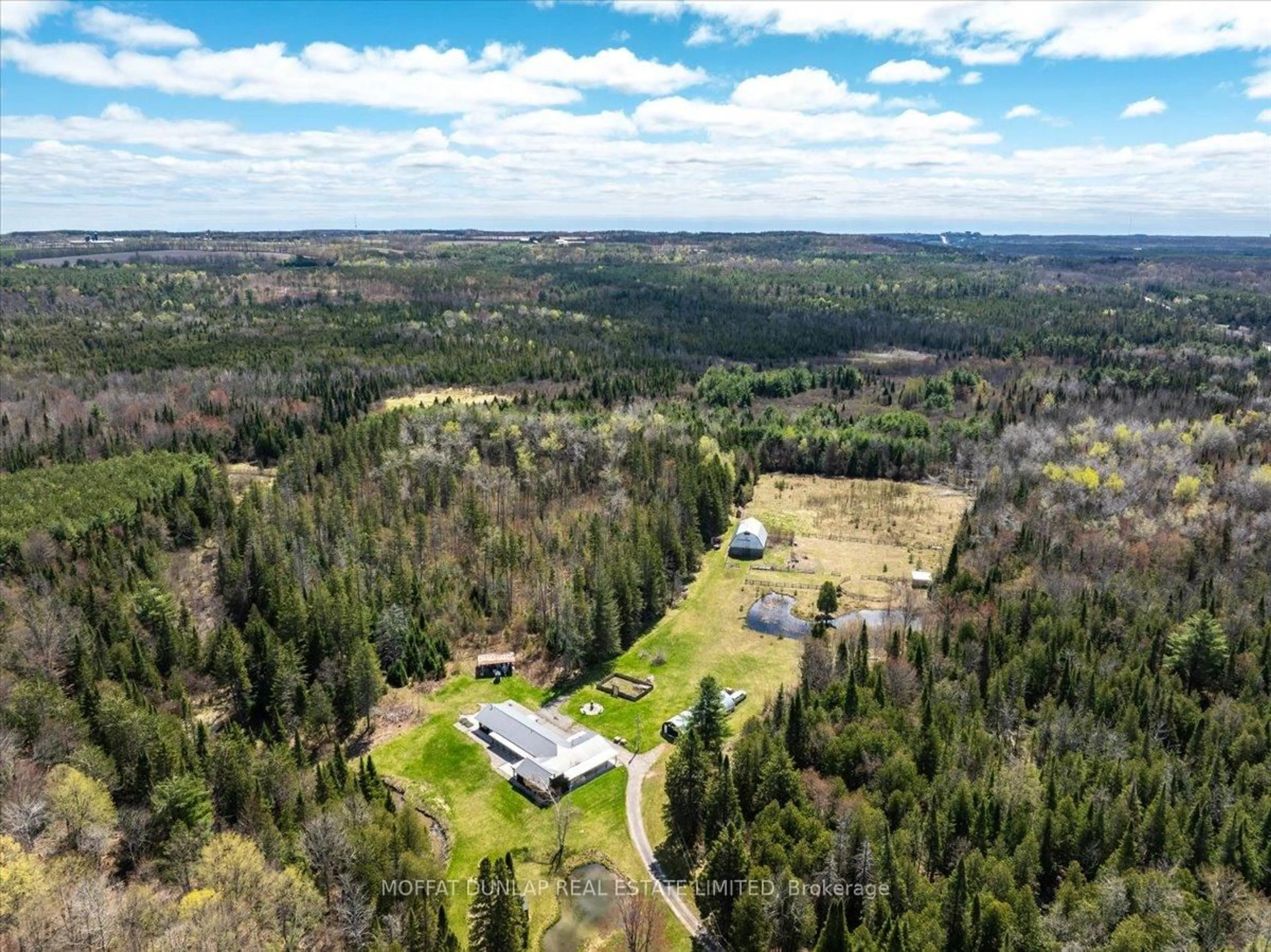 A pic from outside/outdoor area/front of a property/back of a property/a pic from drone, forest/trees view for 1076 Beaver Lane N/A, Springwater Ontario L9X 0M1