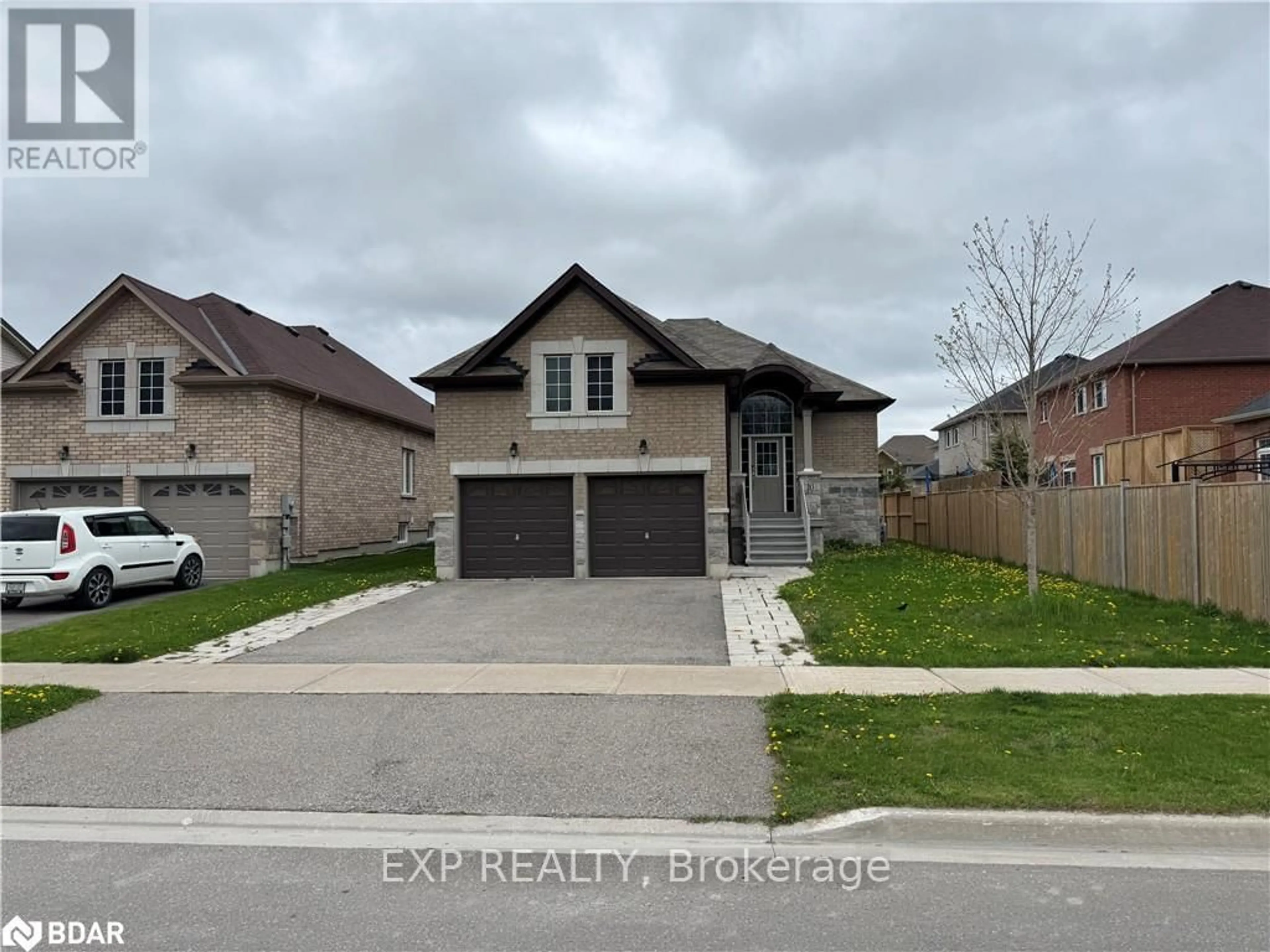 Home with brick exterior material, street for 10 Falvo St, Wasaga Beach Ontario L9Z 0G8