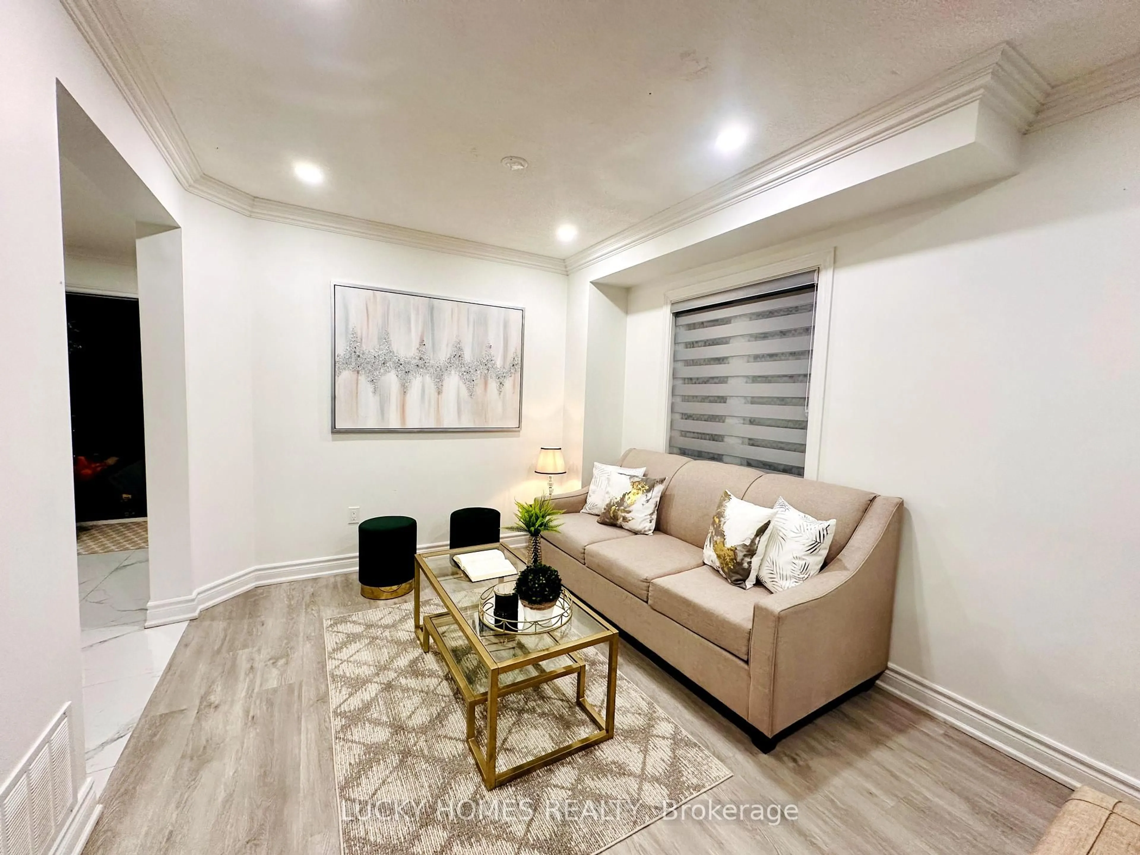 Living room with furniture, wood/laminate floor for 39 Laidlaw Dr, Barrie Ontario L4N 7S2