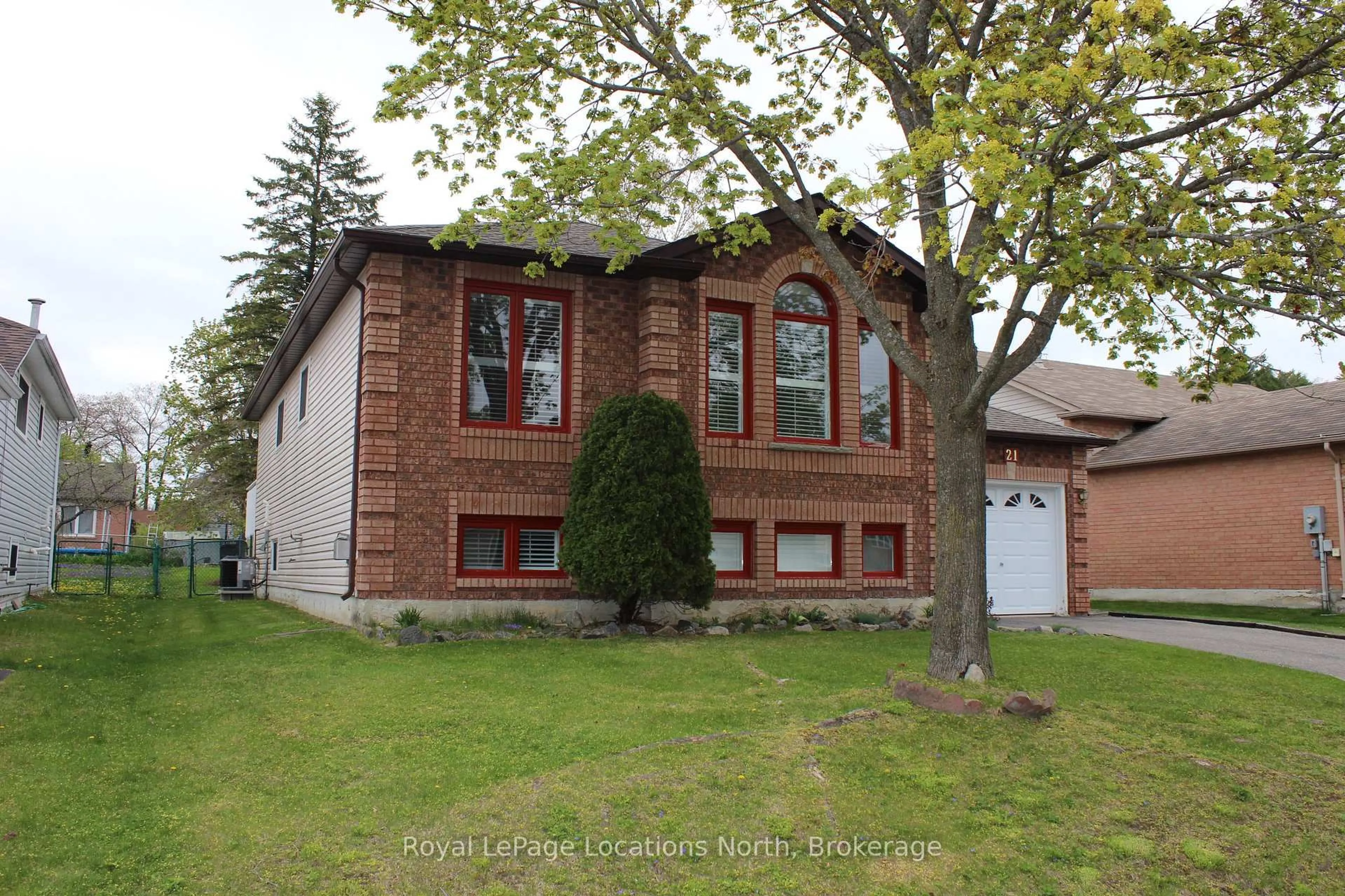 Home with brick exterior material, street for 21 Langevin Dr, Wasaga Beach Ontario L9Z 1C6