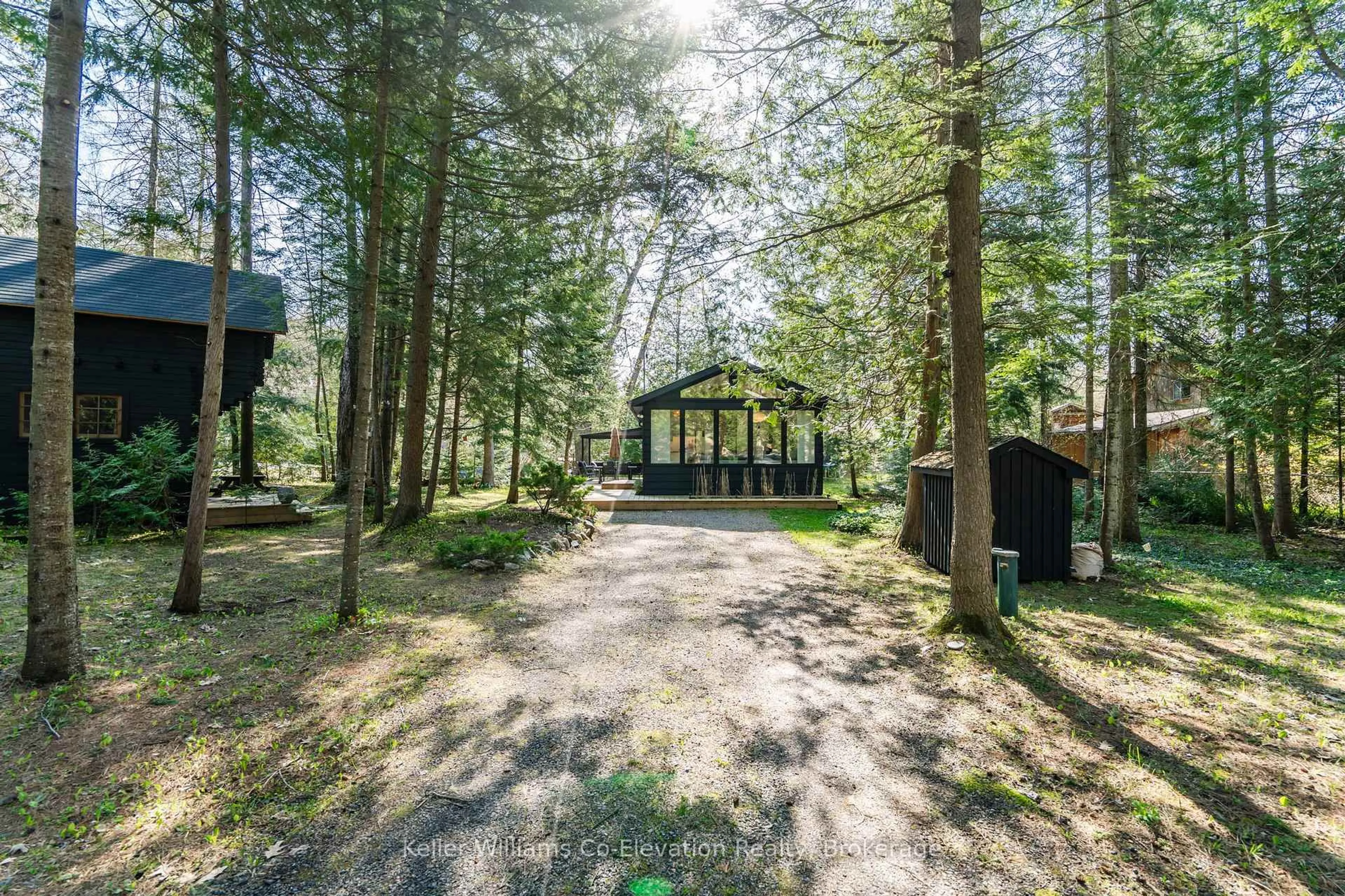 A pic from outside/outdoor area/front of a property/back of a property/a pic from drone, forest/trees view for 1 Sundown Rd, Tiny Ontario L0L 2J0