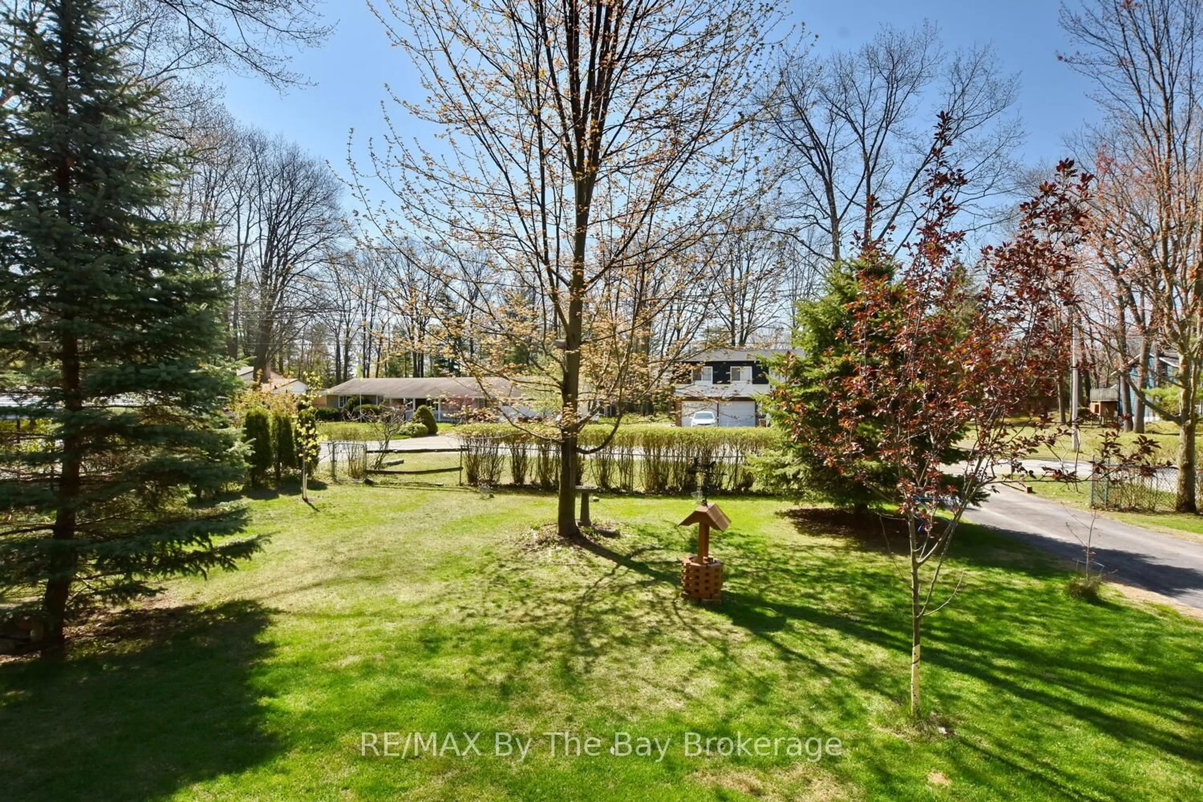 A pic from outside/outdoor area/front of a property/back of a property/a pic from drone, forest/trees view for 82 Helena St, Wasaga Beach Ontario L9Z 1R1