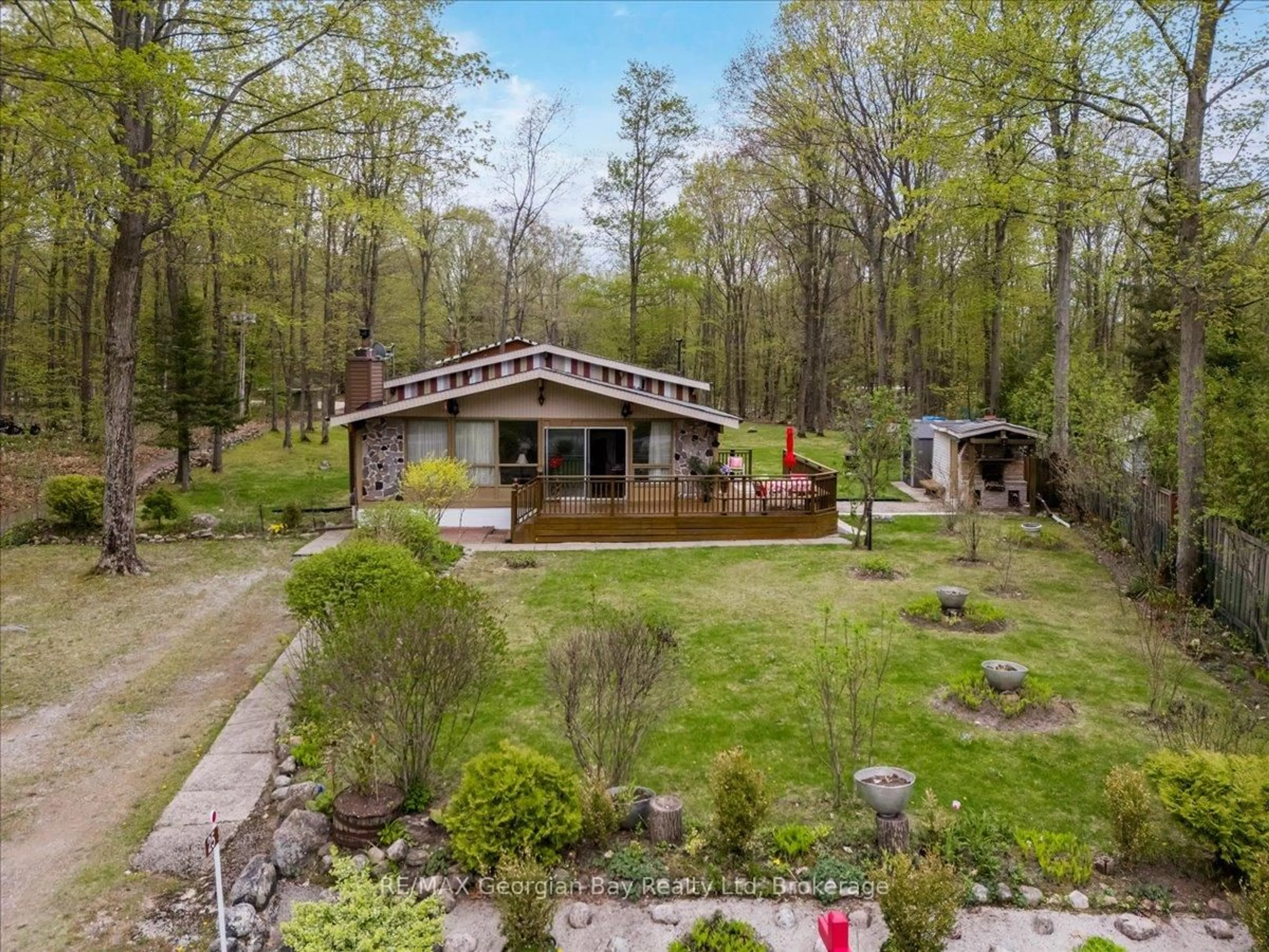 A pic from outside/outdoor area/front of a property/back of a property/a pic from drone, forest/trees view for 25 Tall Pines Dr, Tiny Ontario L9M 0H4