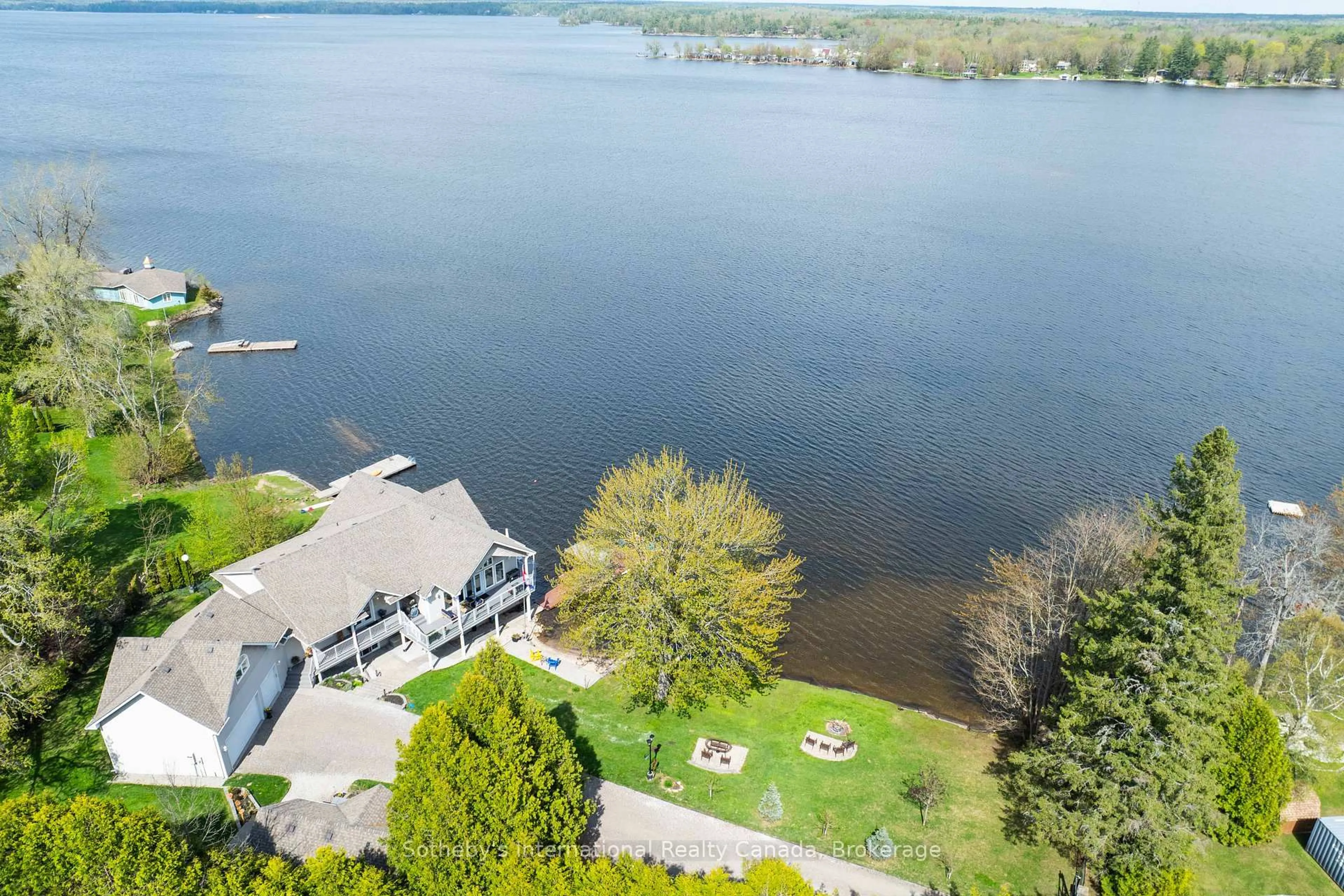 A pic from outside/outdoor area/front of a property/back of a property/a pic from drone, water/lake/river/ocean view for 1601 Port Stanton Pkwy, Severn Ontario P0E 1N0