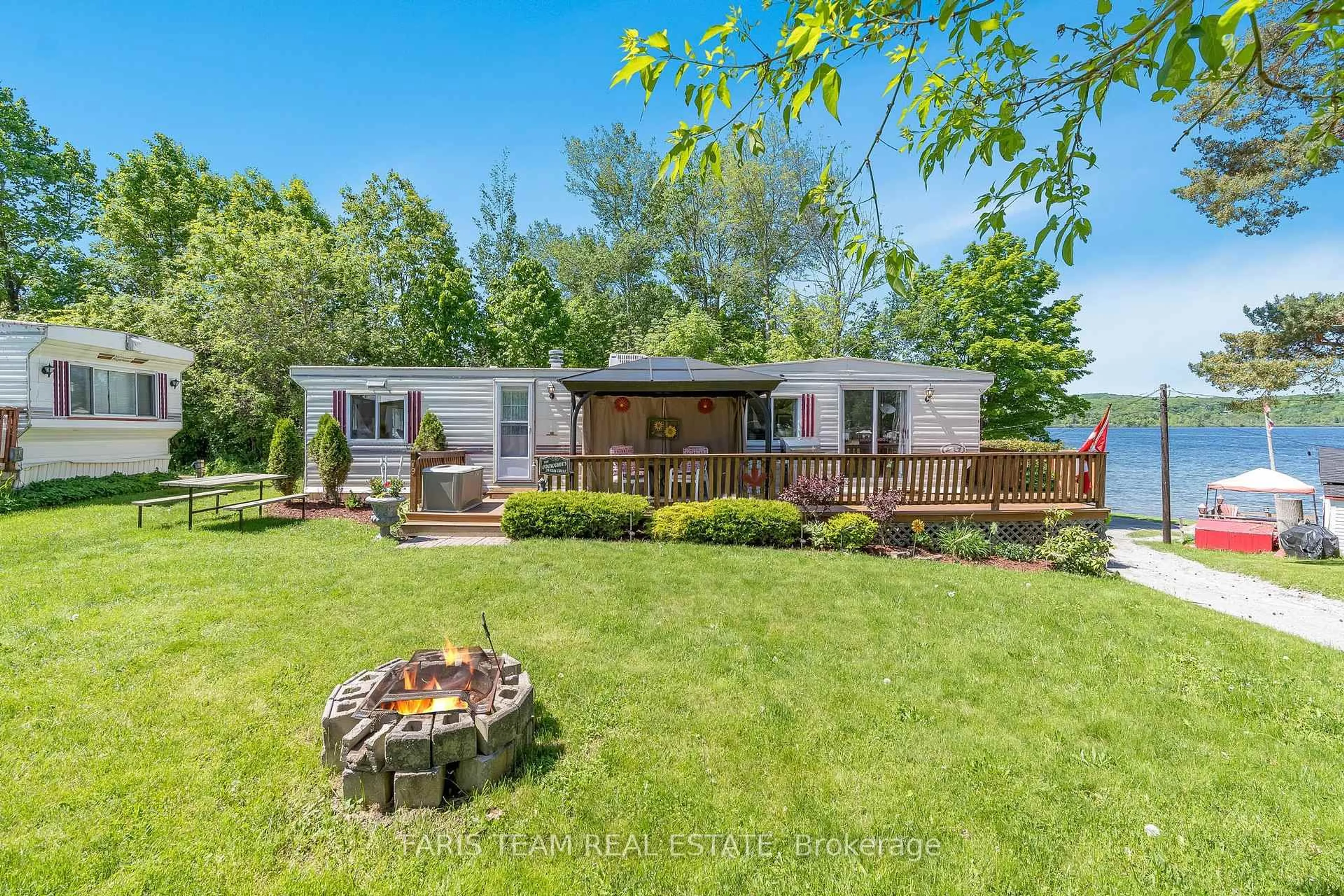 A pic from outside/outdoor area/front of a property/back of a property/a pic from drone, unknown for 79 Stans Circ, Midland Ontario L4R 0B9