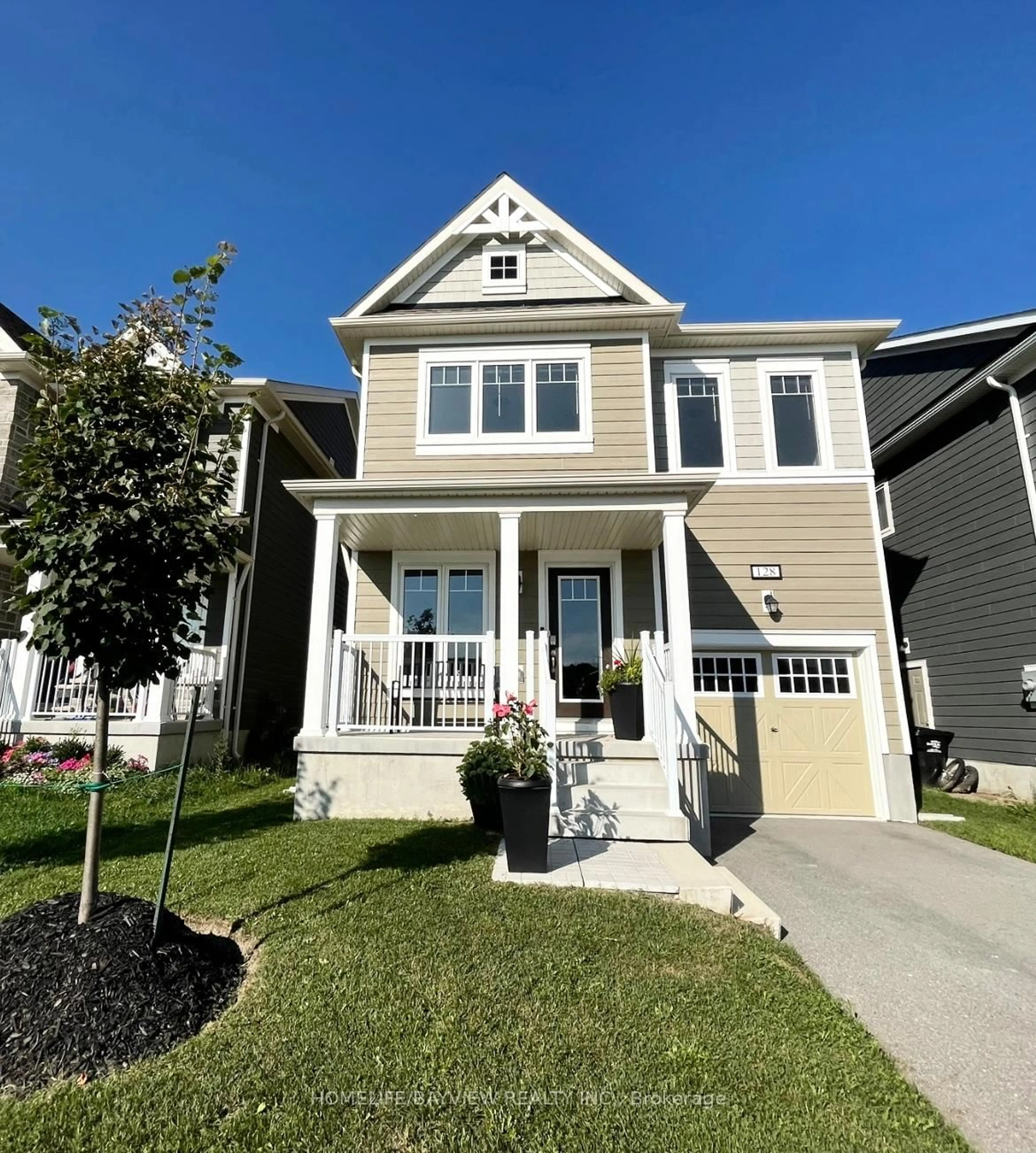 Home with vinyl exterior material, street for 128 Village Gate Dr, Wasaga Beach Ontario L9Z 0J7