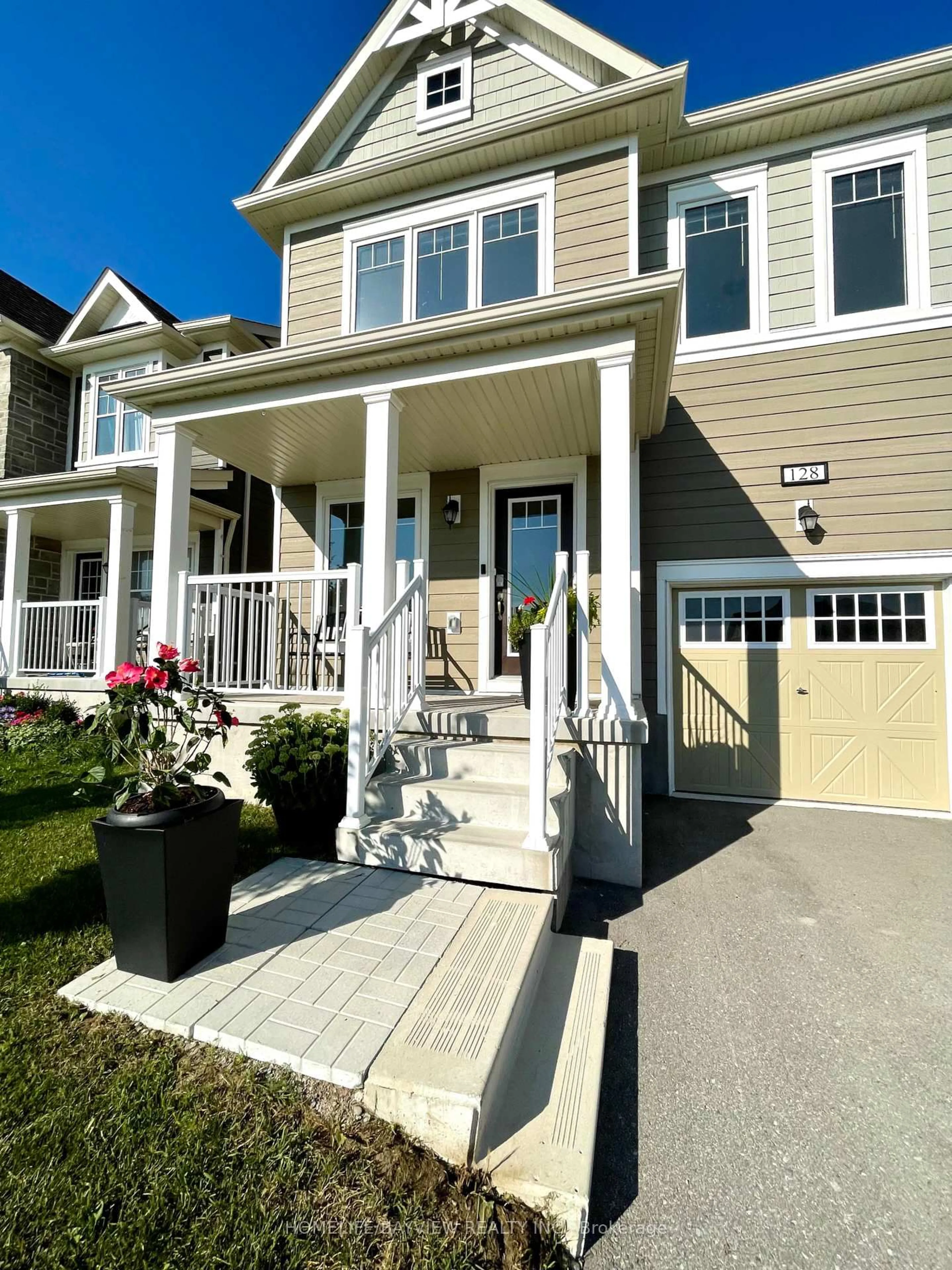 Home with vinyl exterior material, street for 128 Village Gate Dr, Wasaga Beach Ontario L9Z 0J7
