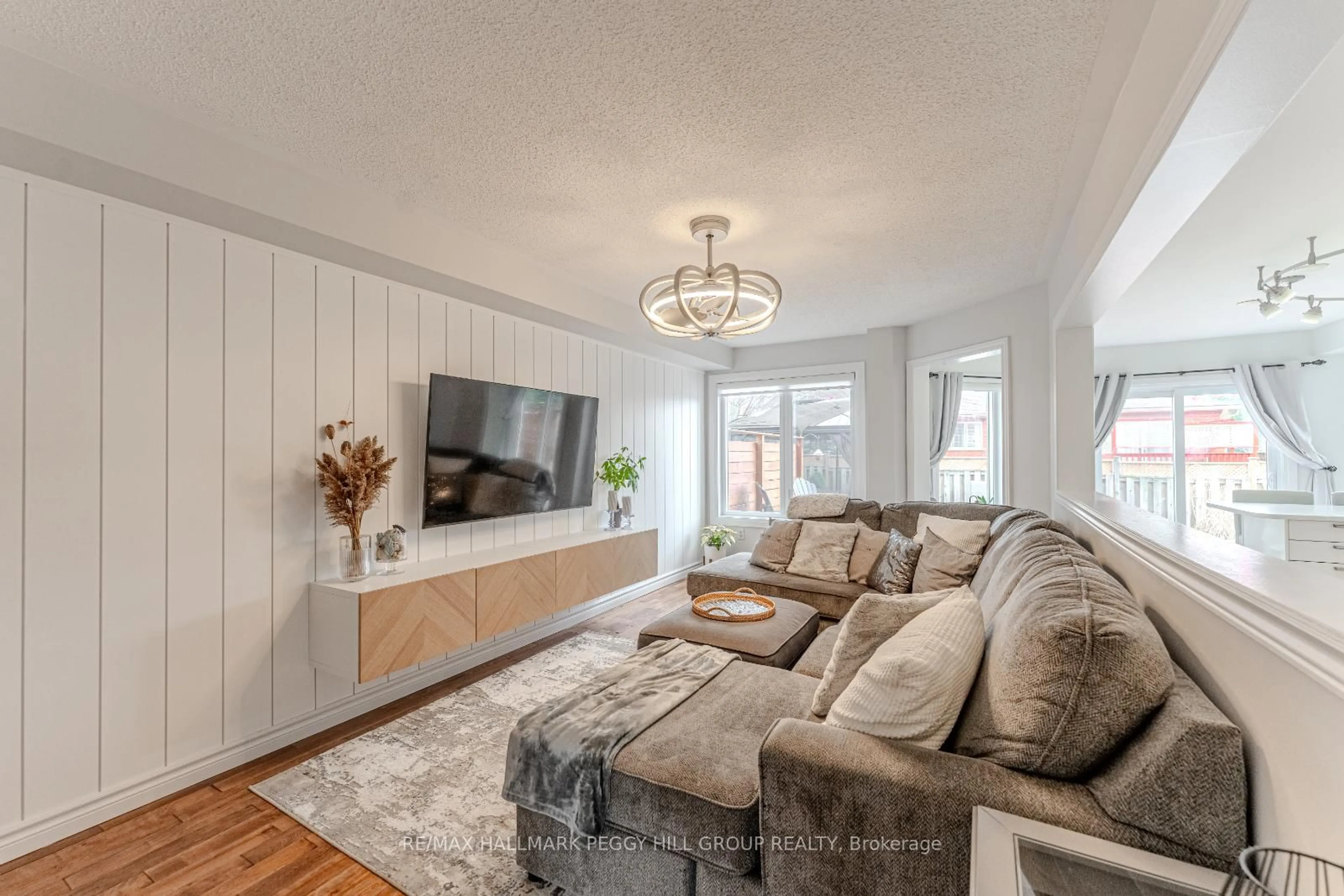 Living room with furniture, wood/laminate floor for 36 Knupp Rd, Barrie Ontario L4N 0P6